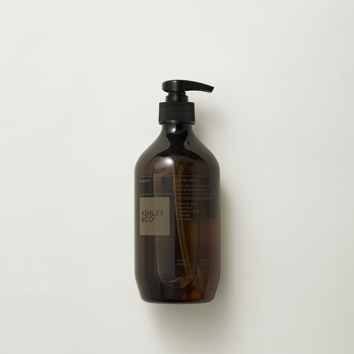 Image showing front of Ashley and Co 'Washup' handwash in lotus leaf and lustre fragrance on a grey background.