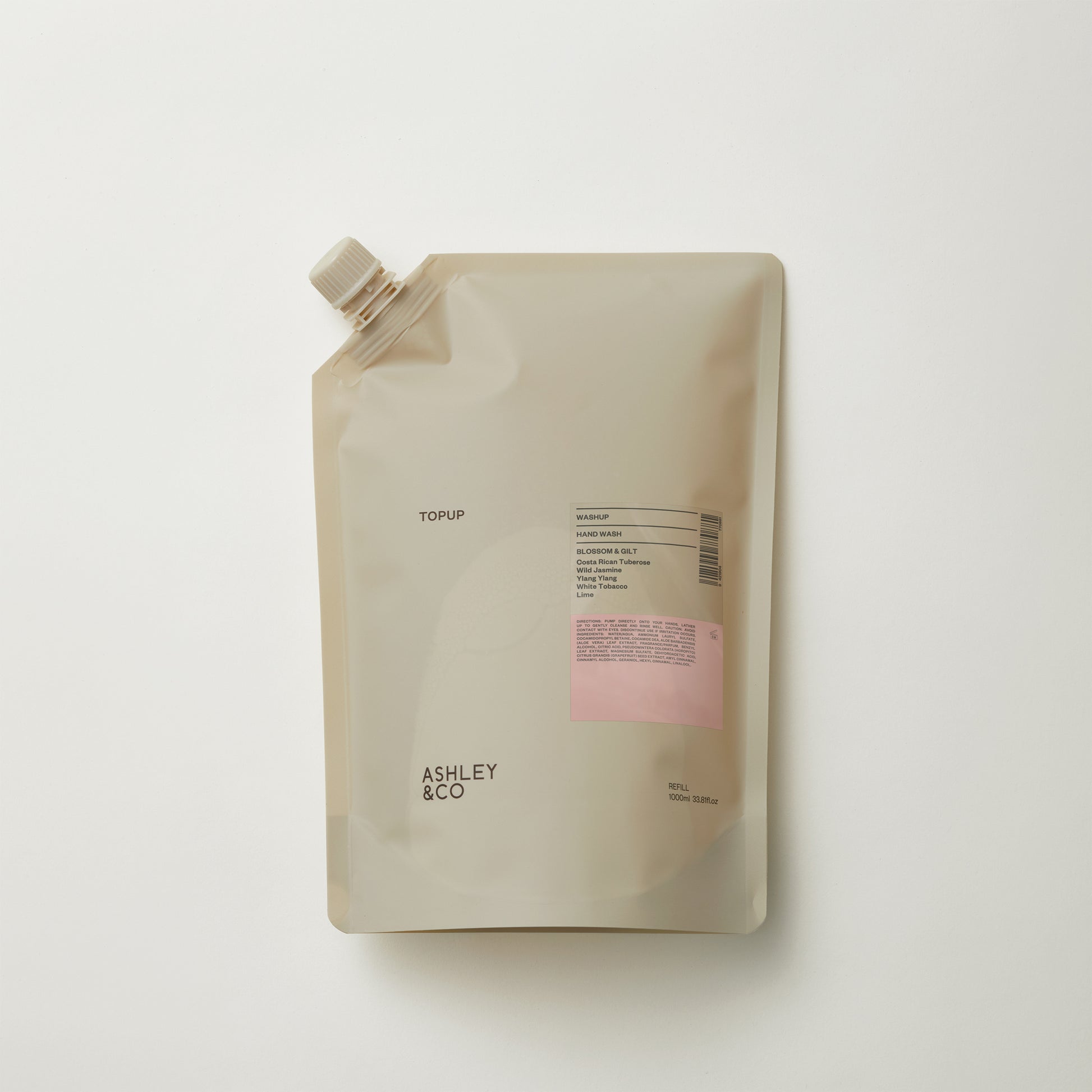 Ashley and Co 'Washup' handwash top up sachet in blossom and gilt fragrance on grey background.