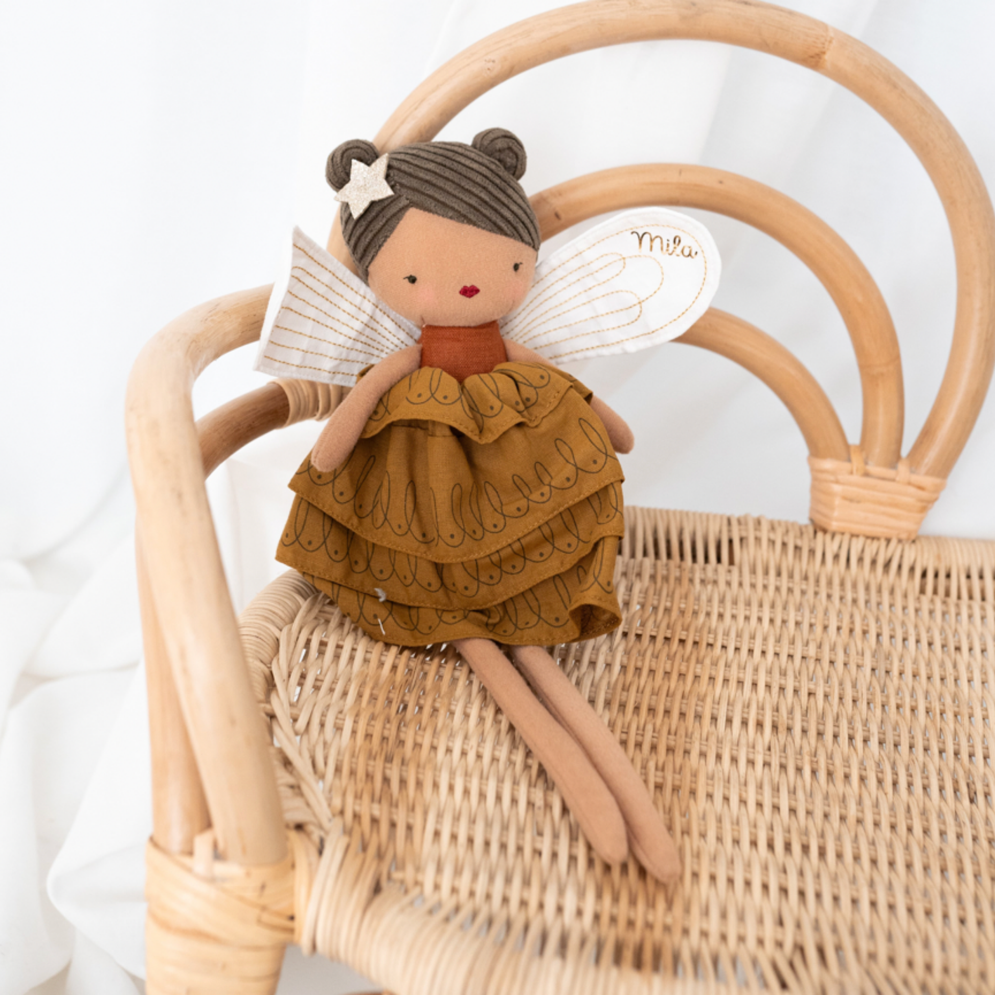Bon Ton Toys Fairy Felicity 35cm Dark Ochre posed on rattan chair lifestyle shot
