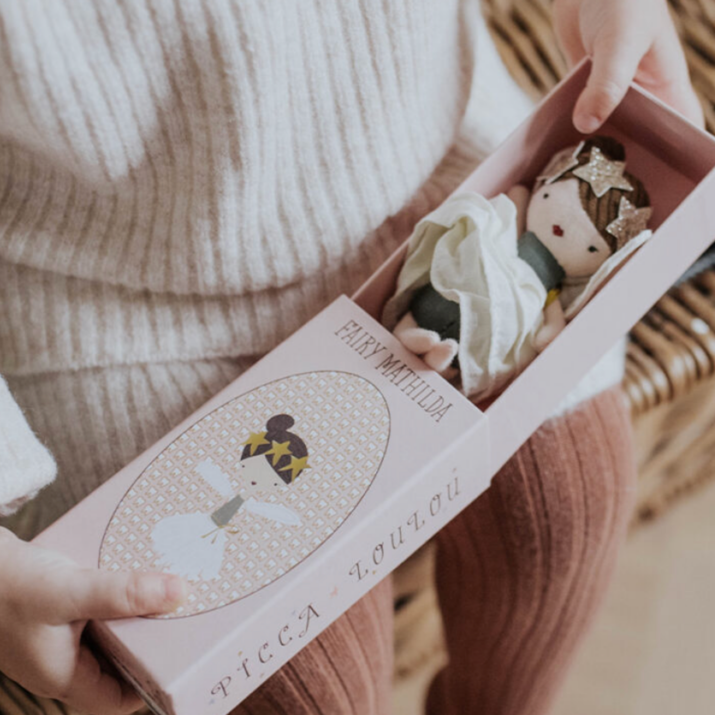 Small child unboxing Bon Ton Toys Fairy Mathilda 11cm in Giftbox lifestyle shot