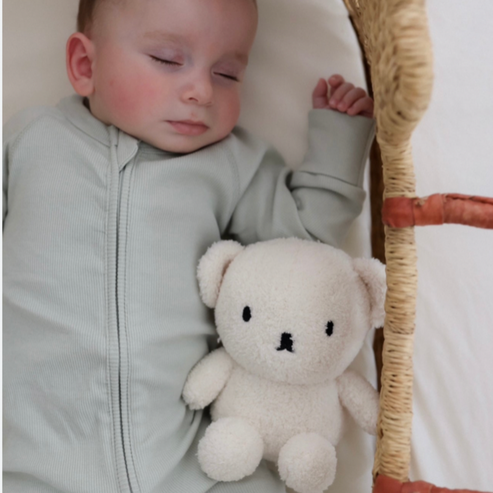 Baby in crib with Bon Ton Toys cream terry 17cm Boris bear plush toy lifestyle shot 