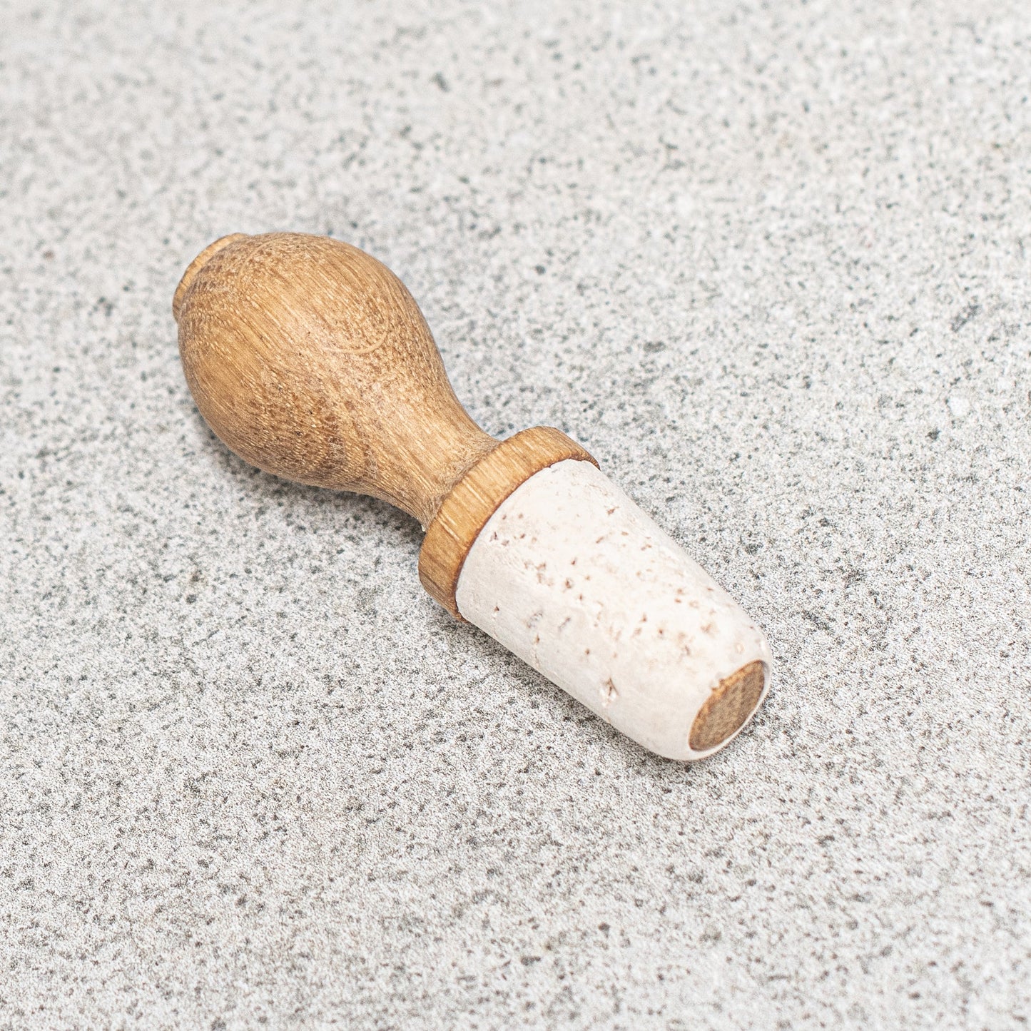 Natural cork and FSC-certified oak wine stopper, designed for an elegant and sustainable way to preserve your wine.