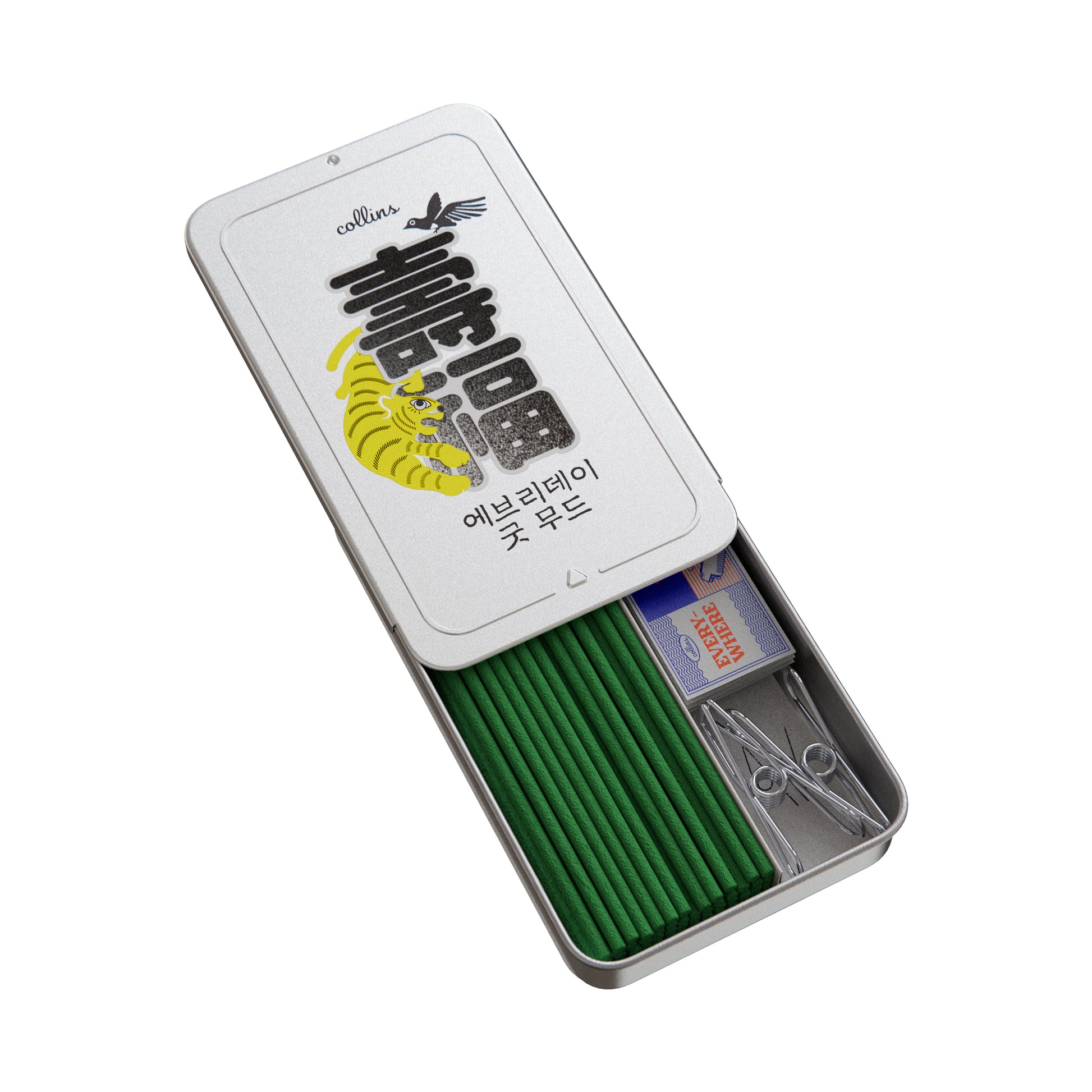 An open tin of Collins natural incense sticks in korea edition scent, in its packaging, overhead shot.