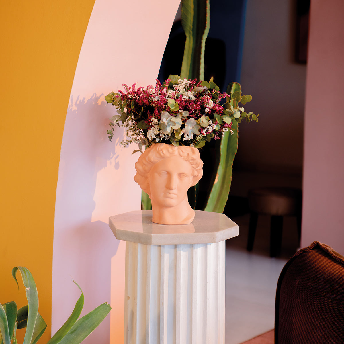 Doiy greek series apollo vase terracotta on white marble plinth with white and pink flowers