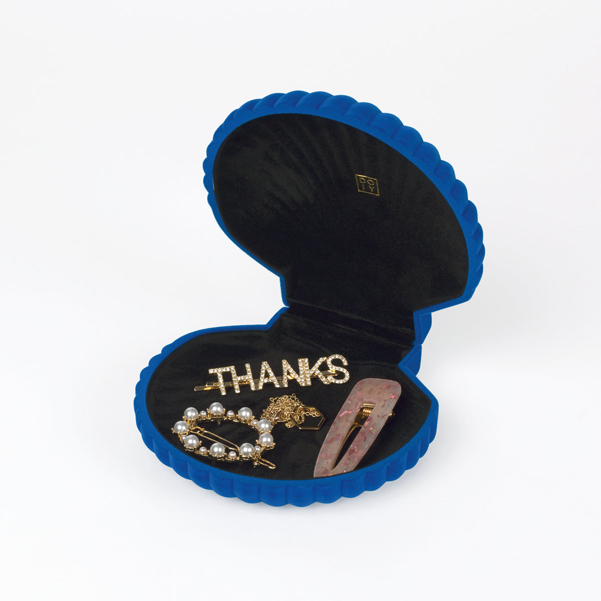 Open DOIY blue velvet venus jewelry box filled with jewels on white background