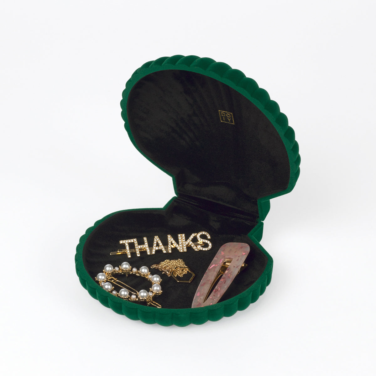 Open DOIY green velvet venus jewelry box filled with jewels on white background