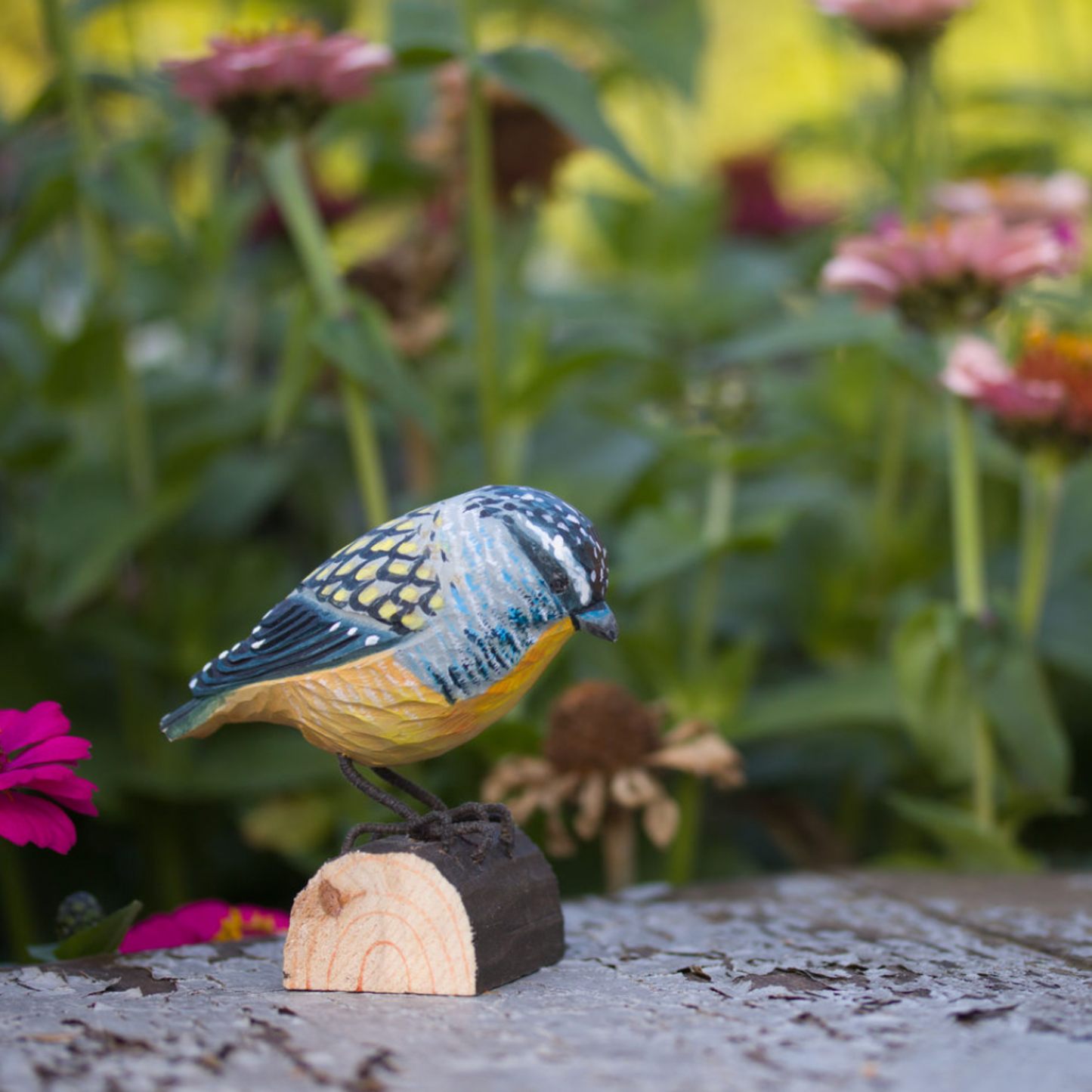 Wildlife Garden Deco Bird Small Spotted Pardolote styled in garden with pink flowers