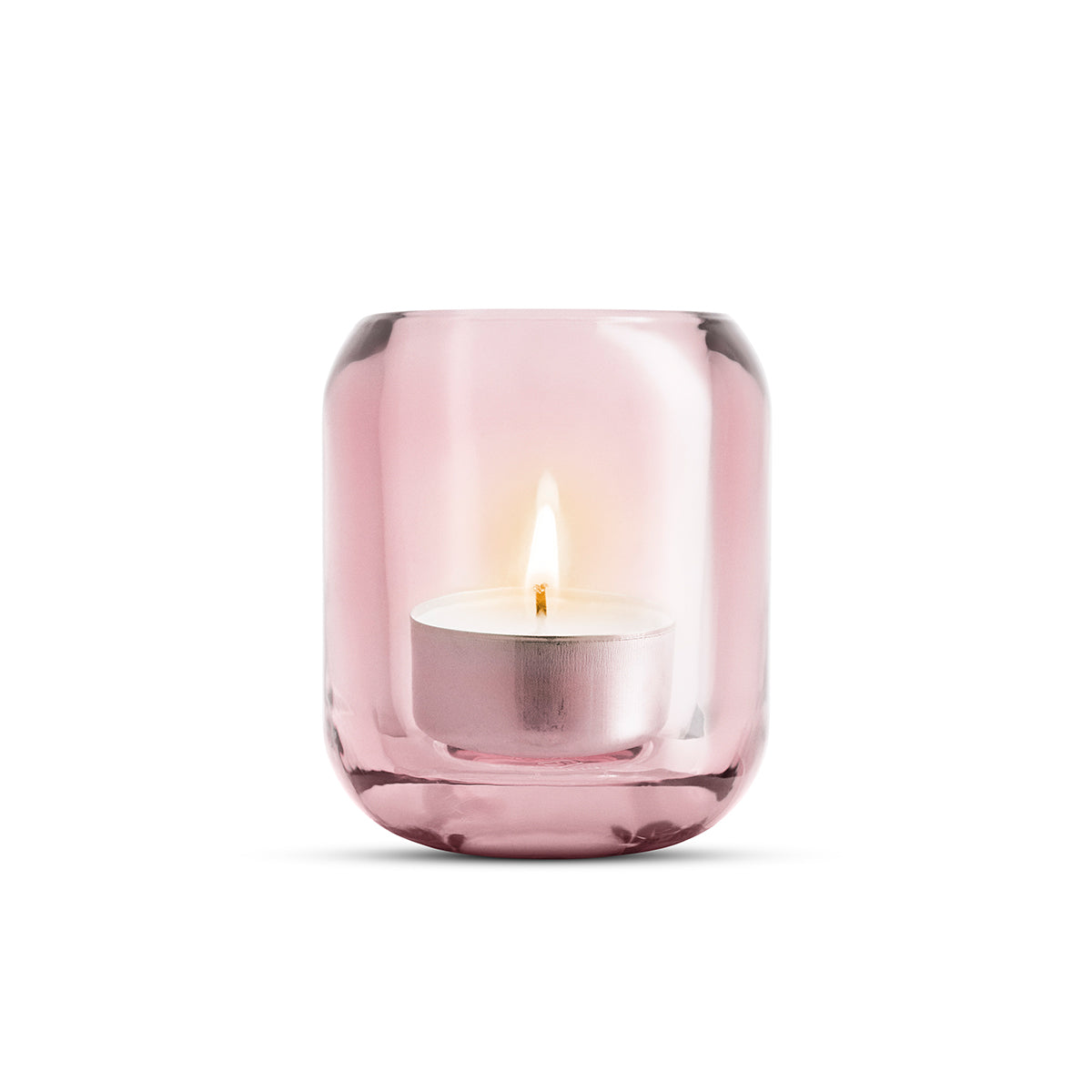 Single glass rose pink coloured Acorn tealight holder by Eva Solo, with a lit candle inside