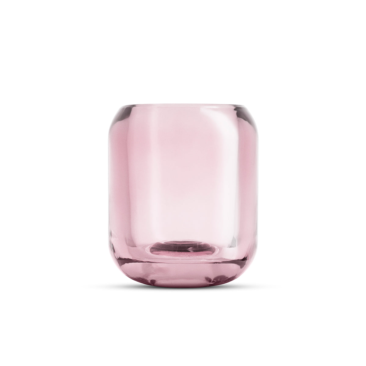 Close-up of glass Acorn tealight holder by Eva Solo, in rose pink colour.