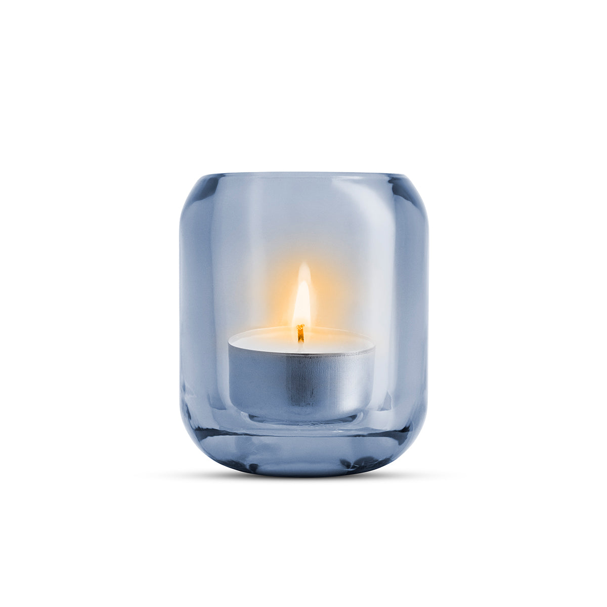 Single glass sea blue coloured Acorn tealight holder by Eva Solo, with a lit candle inside