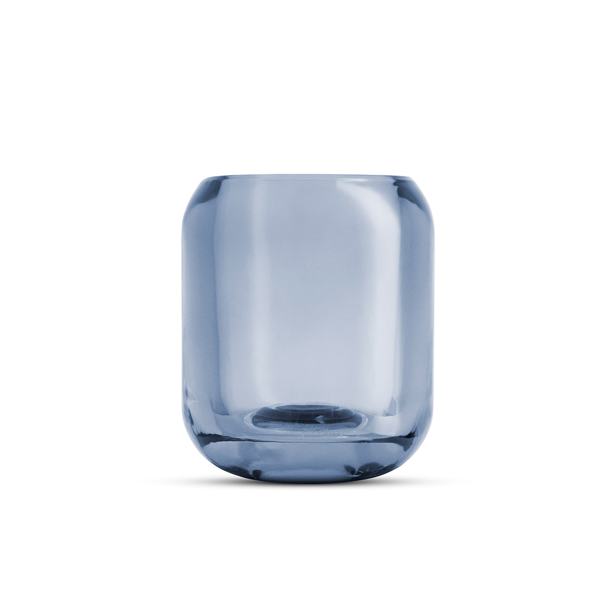 Close-up of glass Acorn tealight holder by Eva Solo, in sea blue colour.