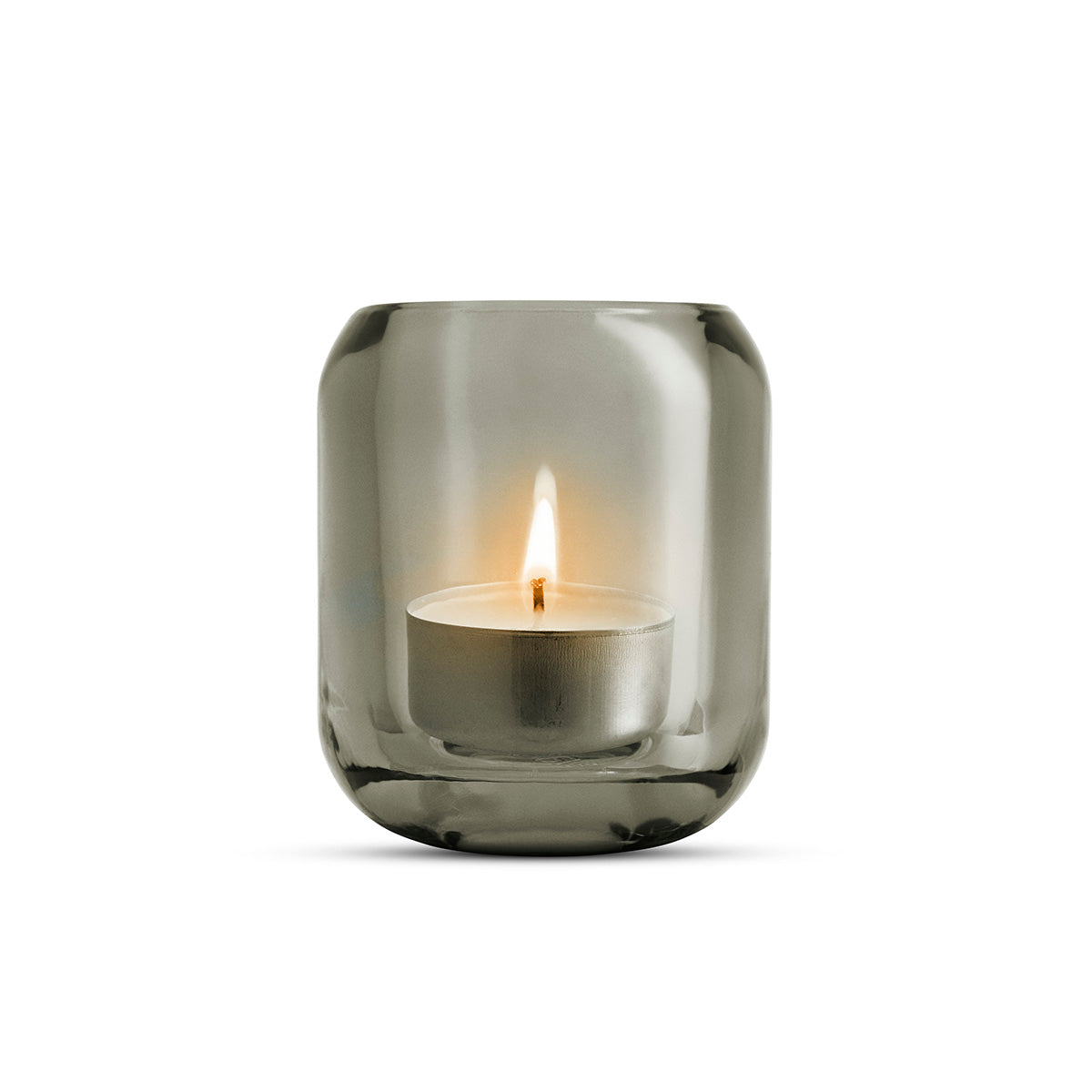 Single glass stone grey coloured Acorn tealight holder by Eva Solo, with a lit candle inside