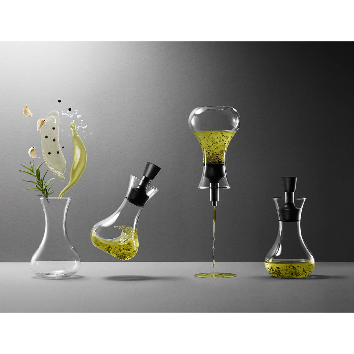 Showing Eva Solo dressing shakers seen with pouring, shaken and mixing ingredients - clear glass bottle, filled with oil transparent food-safe container for mixing and storing salad dressings, oils, and liquid seasonings.