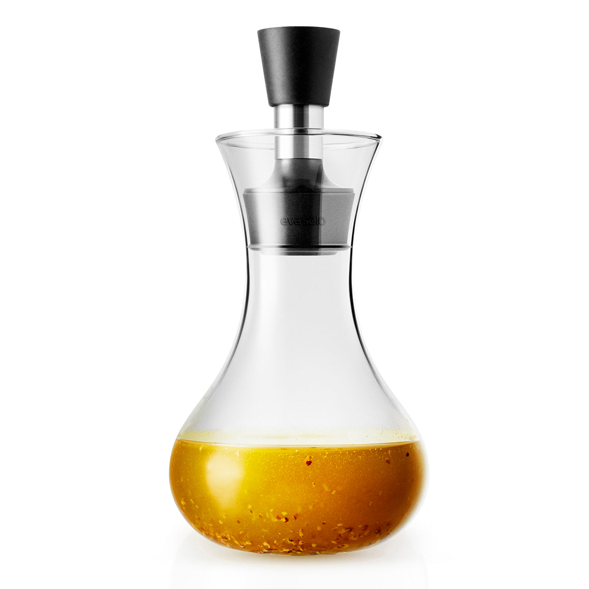 Mixed dressing inside the bottle of Eva Solo dressing shaker - clear glass bottle, transparent food-safe container for mixing and storing salad dressings, oils, and liquid seasonings.