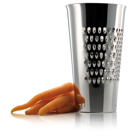 Eva Solo grating bucket with carrots beside it - stainless steel kitchen grater in silver color, cylindrical design for grating vegetables, cheese, and chocolate directly into the bowl.