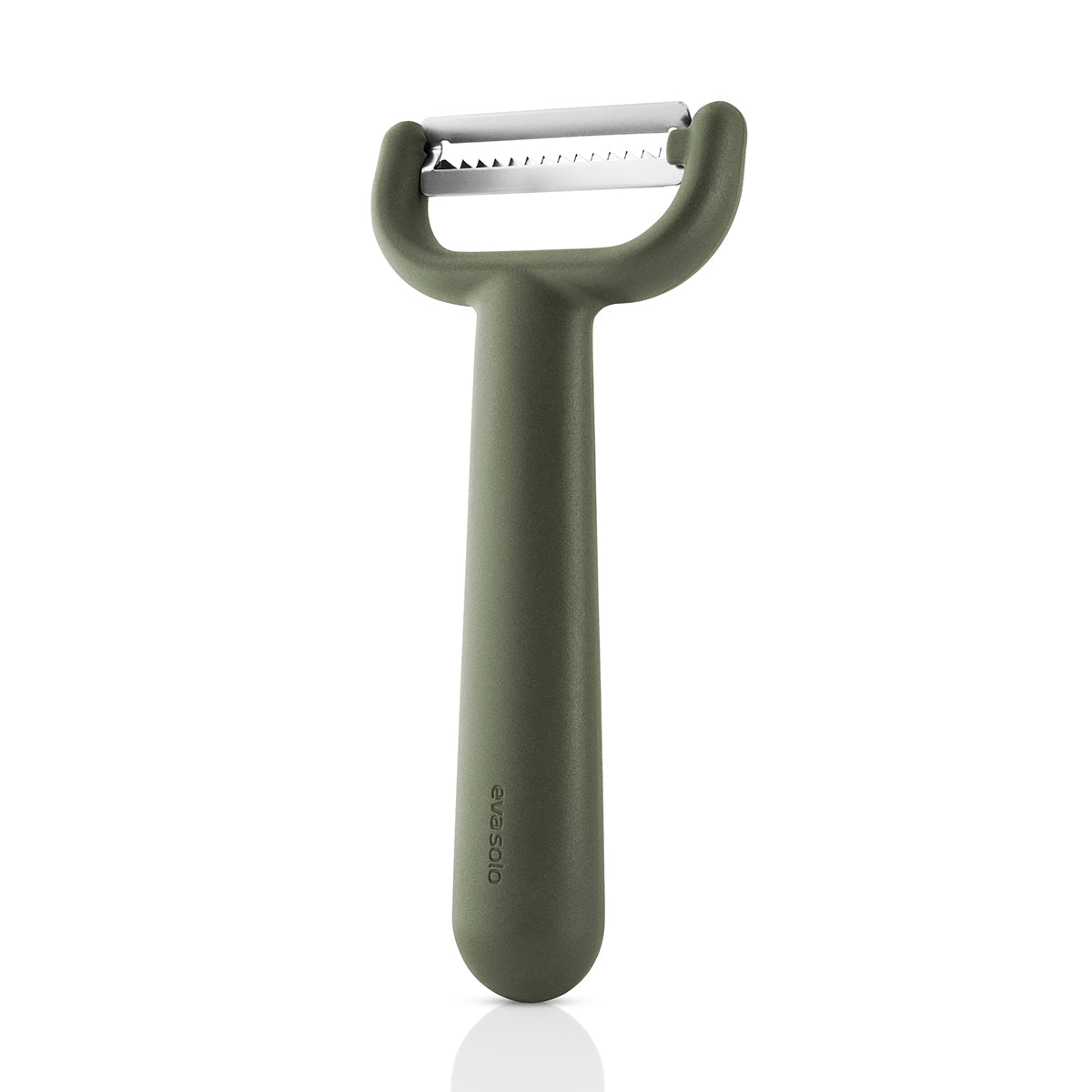 Eva Solo green tool Julienne Peeler standng upright .