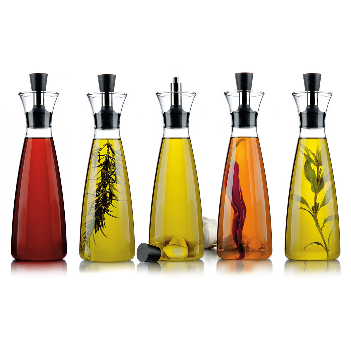 5 Oil & Vinegar carafes by Eva Solo filled with various infused oils and vinegar