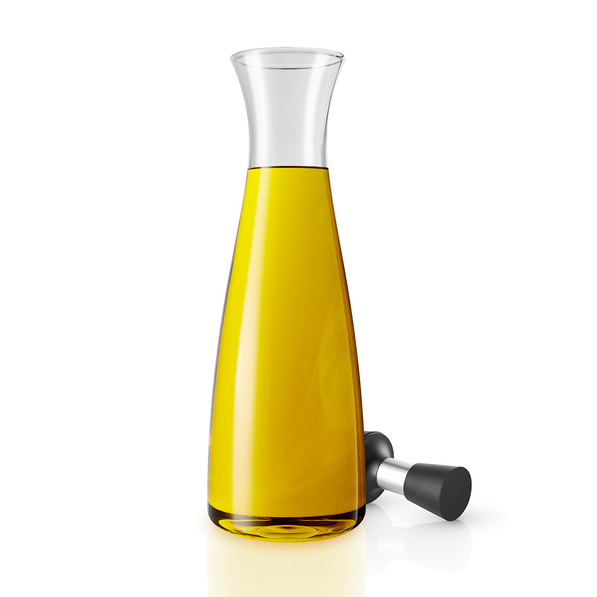 Oil & Vinegar carafe by Eva Solo filled with oil with cap removed.