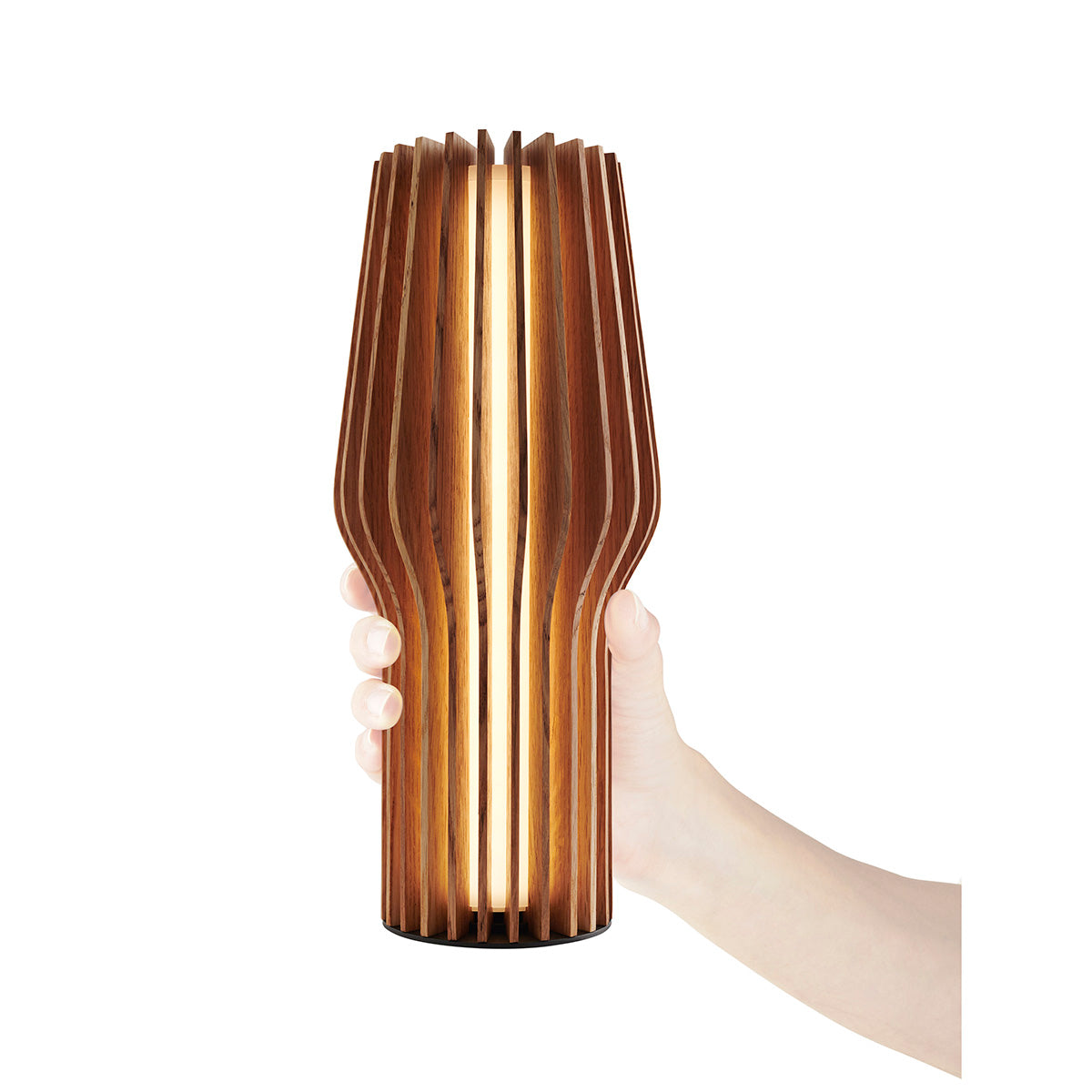 Eva Solo Radiant Rechargeable Table Lamp Oak being held up.