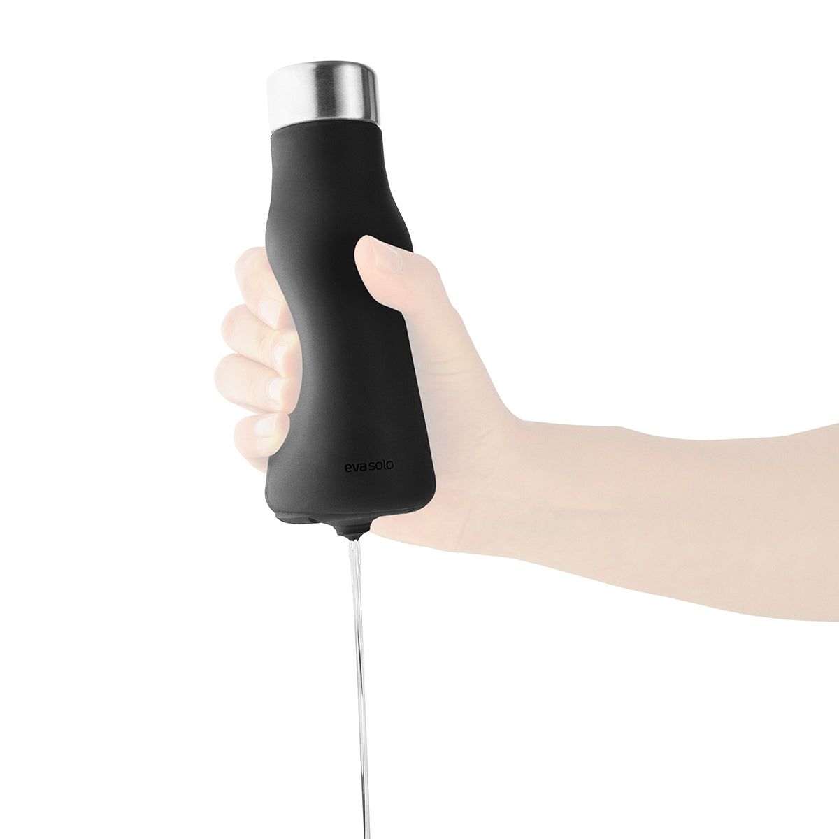 Image of Soap Dispenser Squeeze Black by Eva Solo shown squeezing out soap