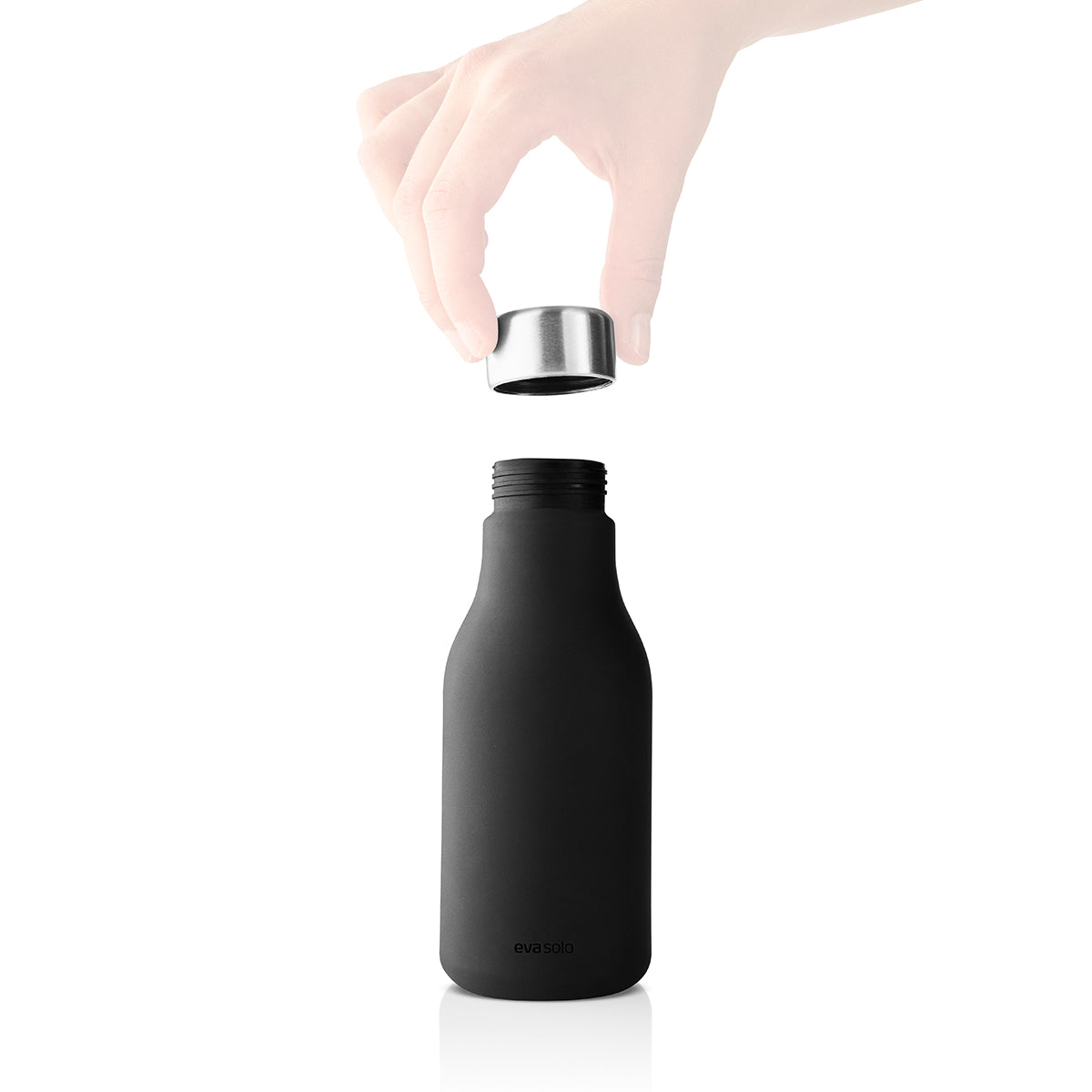 Image of Soap Dispenser Squeeze Black by Eva Solo with lid being removed.
