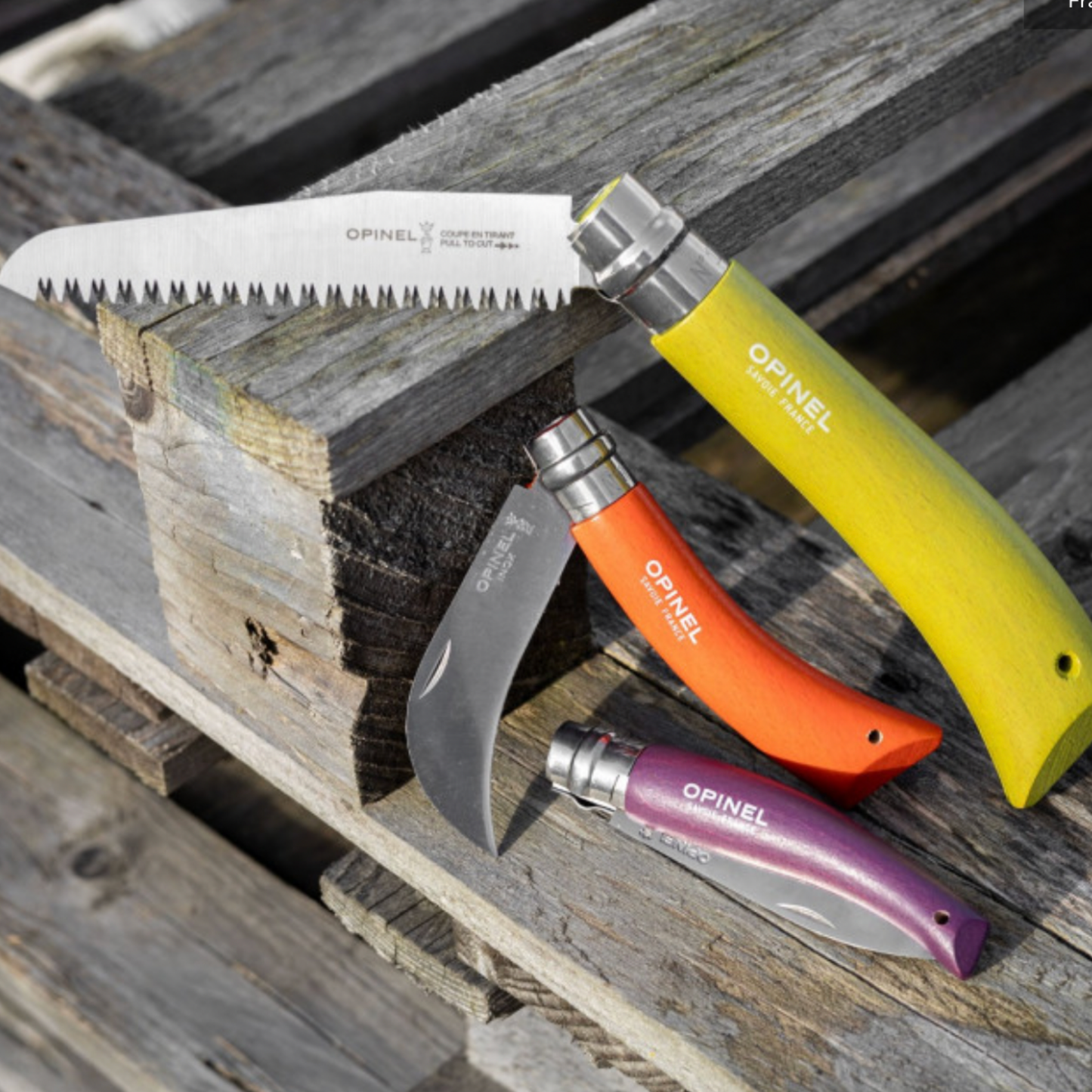 Opinel foldable Garden Tools 3pc Box Set in box on display resting against wooden pallets 