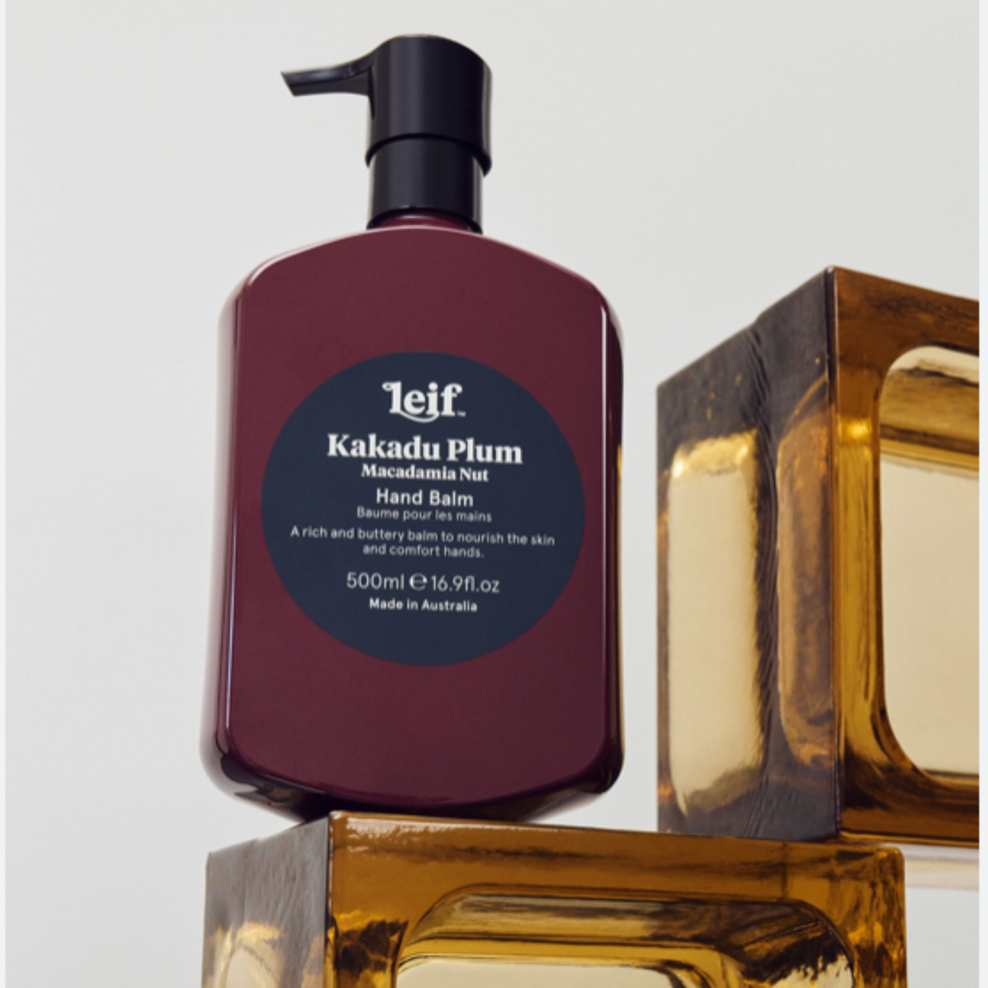 Leif hand balm 500ml Kakadu Plum positioned on orange glass blocks 