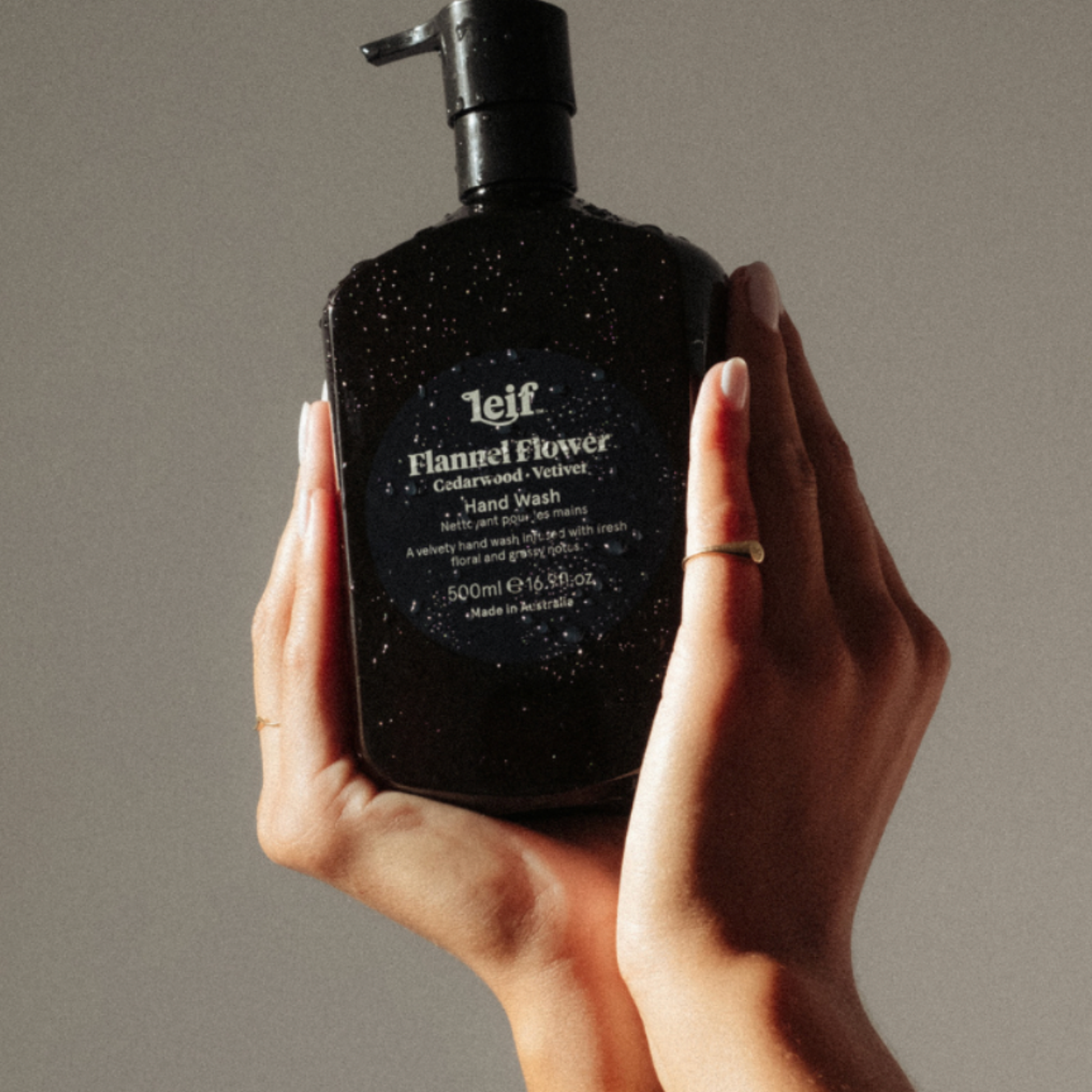 Woman holding Leif hand wash 500ml Flannel Flower in to hands 