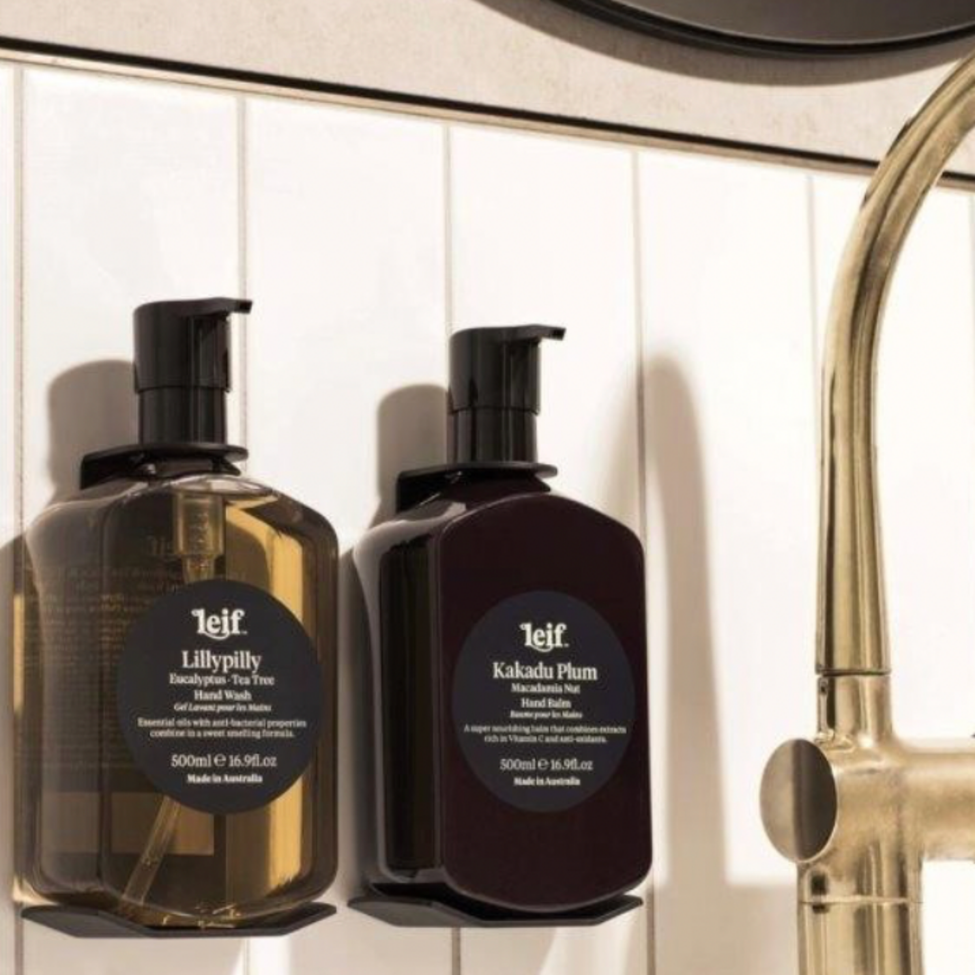 Leif hand wash 500ml Lillypilly in use in bathroom accompanied by Leif 500ml hand balm Kakadu Plum