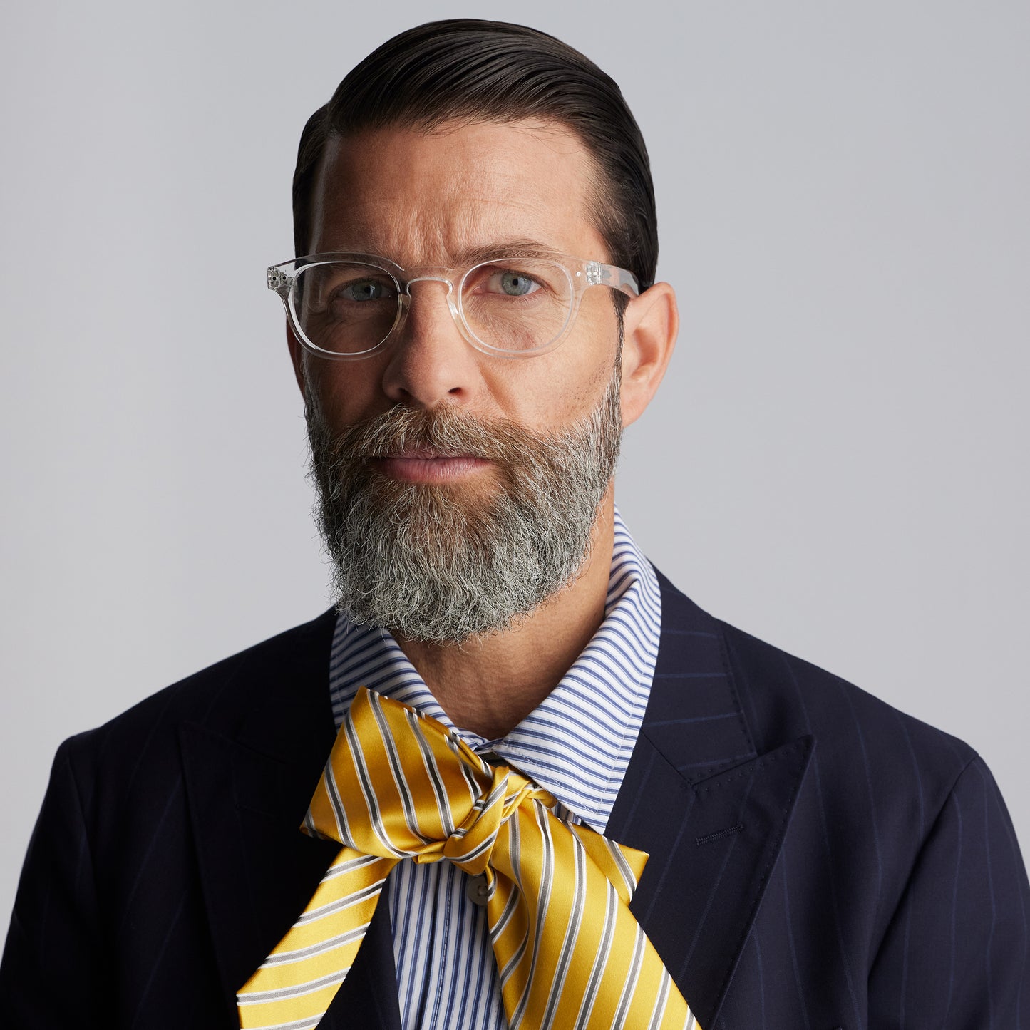 Front view of a man wearing IZIPIZI Reading Glasses - Crystal Clear - Lightweight Plastic Frame - Flexible Rubber Arms - Unisex Square Shape C - Transparent Readers for Everyday Comfort