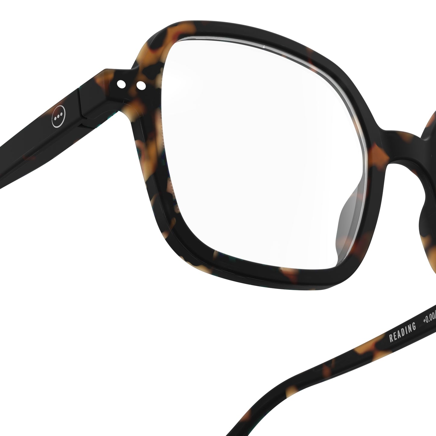 Upclose one side right glass showing circles from IZIPIZI Reading Collection O Tortoise glasses with bio-sourced frame, soft-touch finish, flexible spring hinges, and oversized retro square design - lightweight unisex reading eyewear available in +1 to +3 diopters, includes soft pouch and gift box.