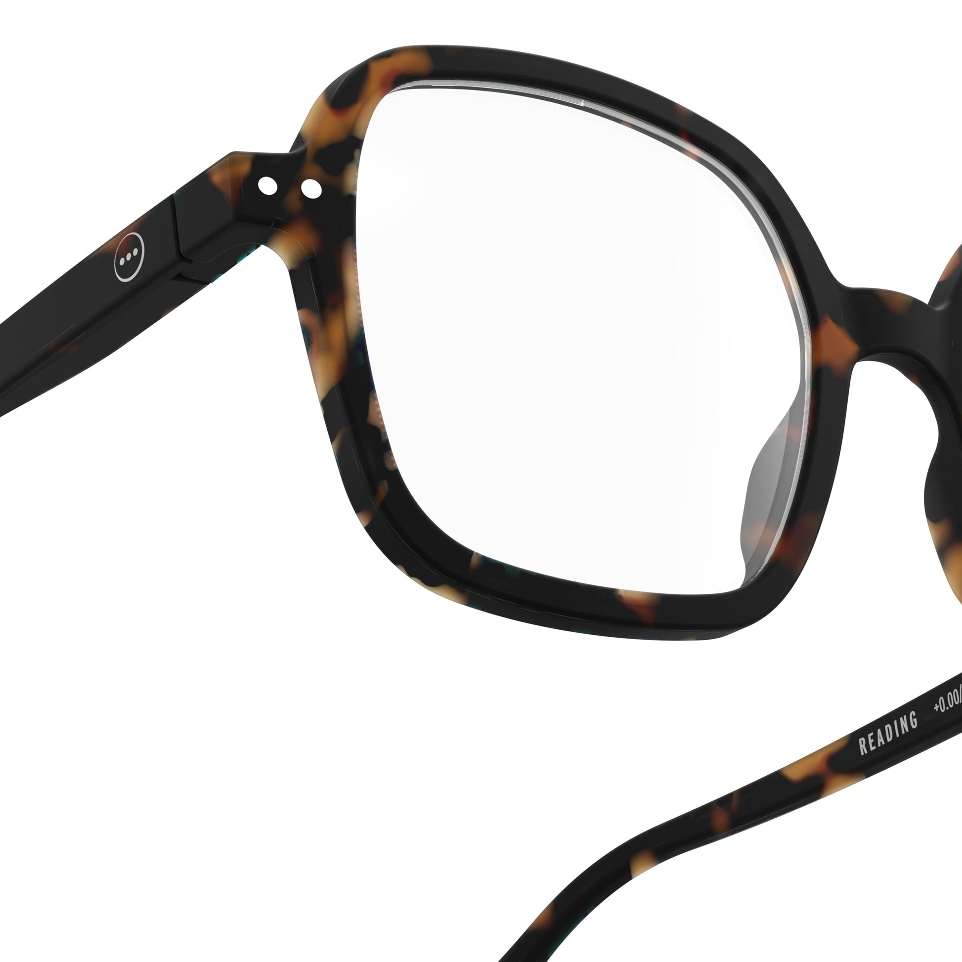 Upclose one side right glass showing circles from IZIPIZI Reading Collection O Tortoise glasses with bio-sourced frame, soft-touch finish, flexible spring hinges, and oversized retro square design - lightweight unisex reading eyewear available in +1 to +3 diopters, includes soft pouch and gift box.