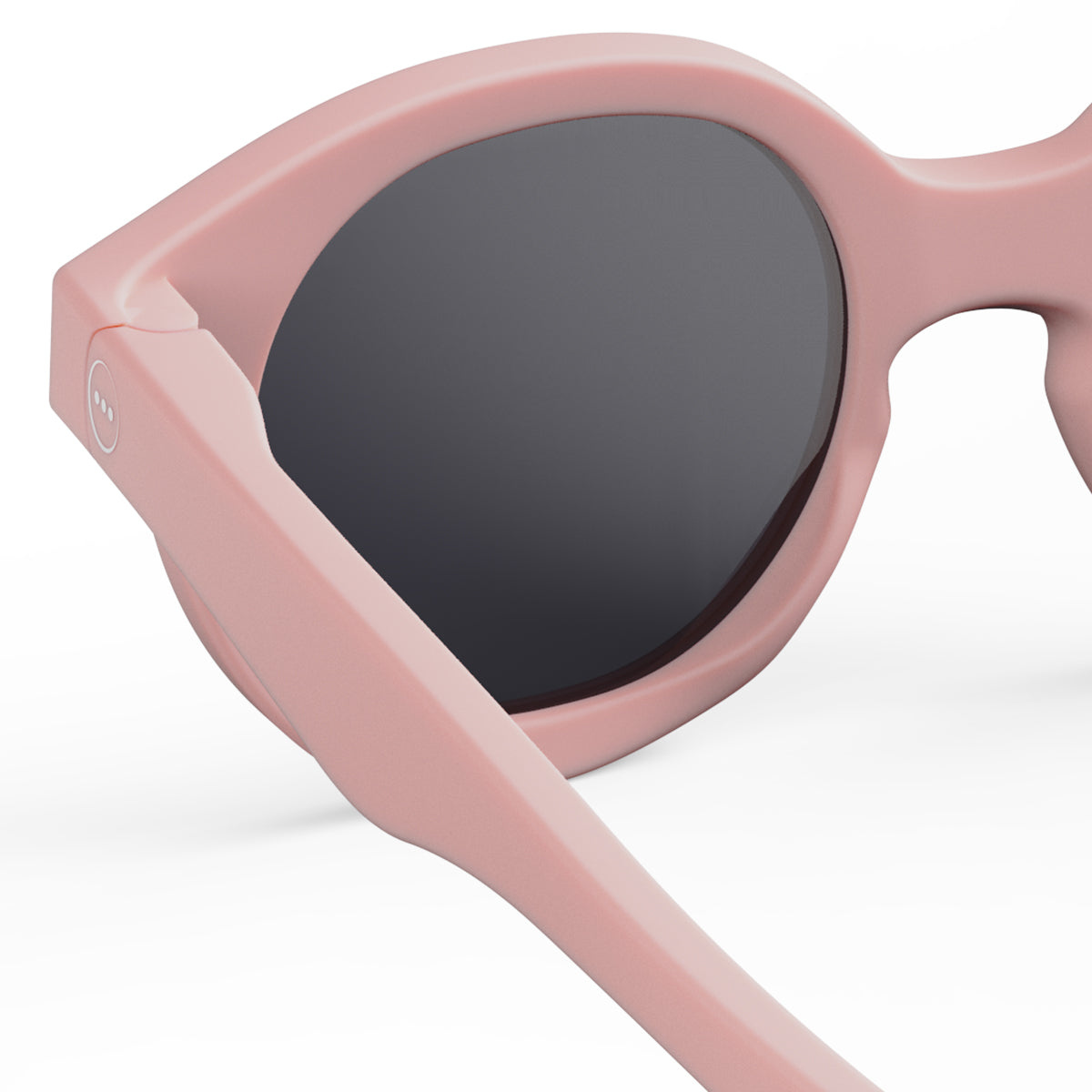 Izipizi kids sunglasses shape c pastel pink close up of back left hand side on white background