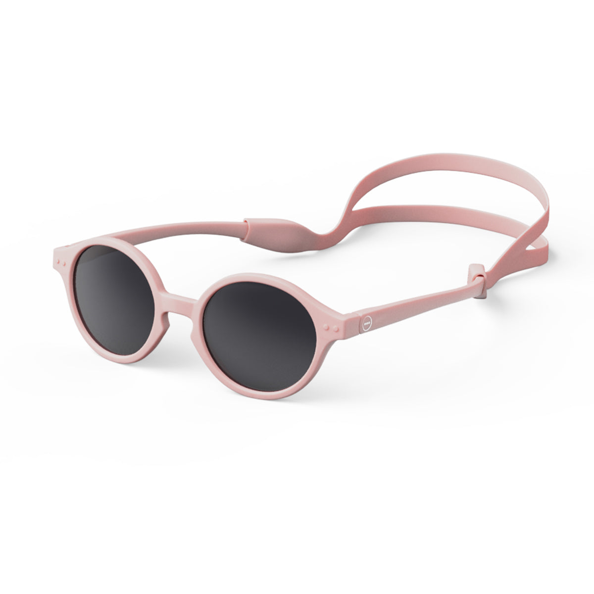 Izipizi kids sunglasses shape d pastel pink on an angle with silicone head strap on white background