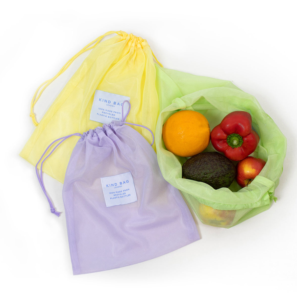 Image showing set of 3 Regusable Mesh bags by Kind bag in flat lay format with green bag holding fruits