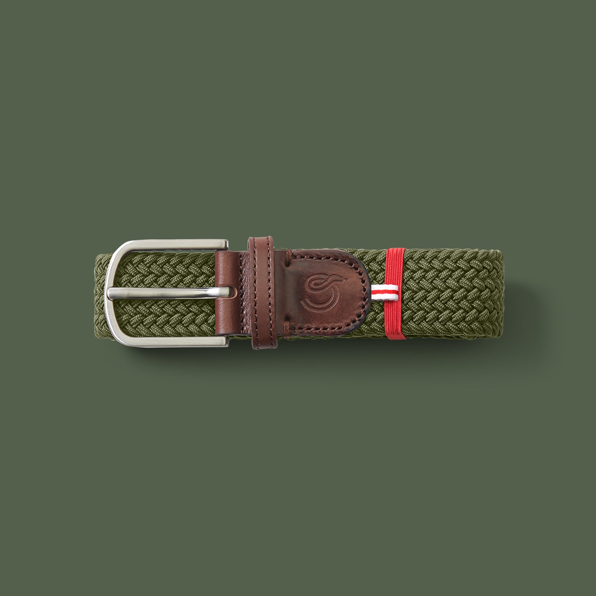 La Boucle mono edinburgh woven belt folded on green background