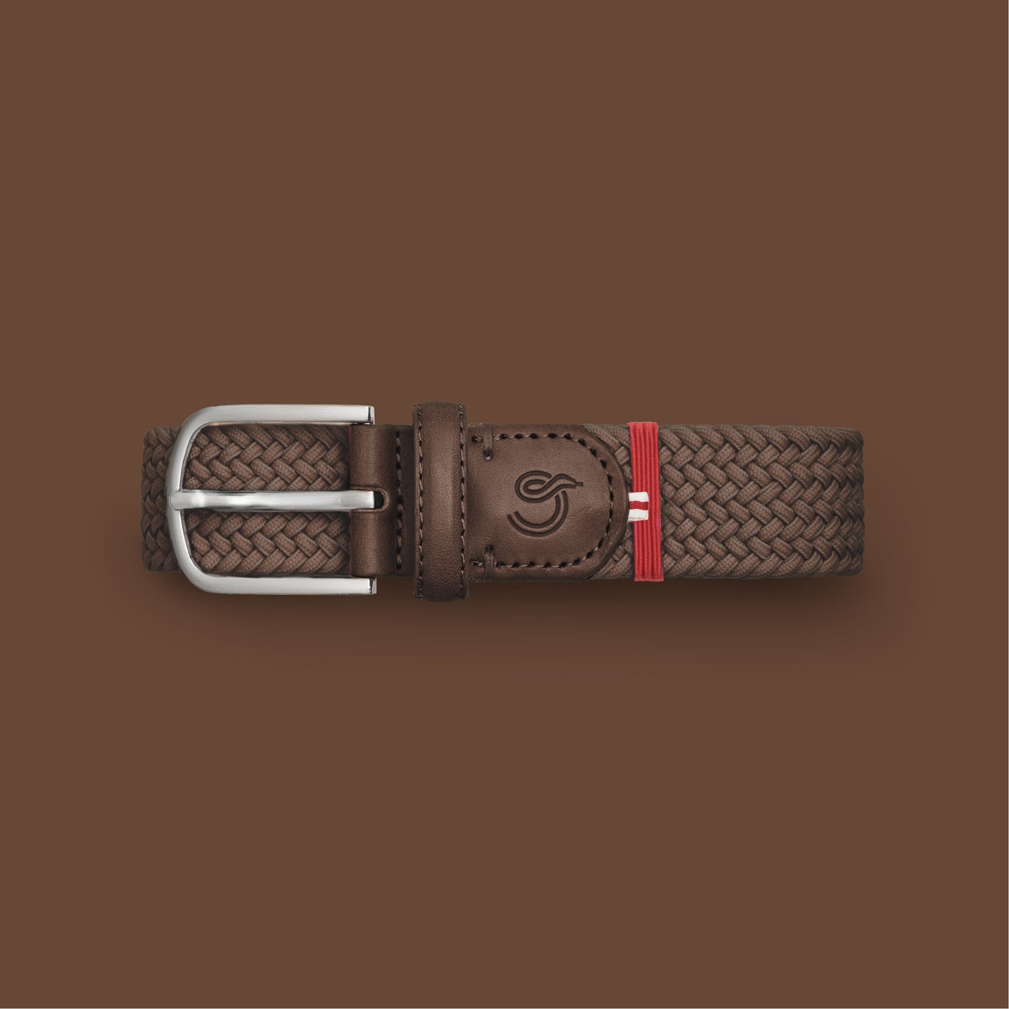 La Boucle mono edinburgh woven belt folded on brown background