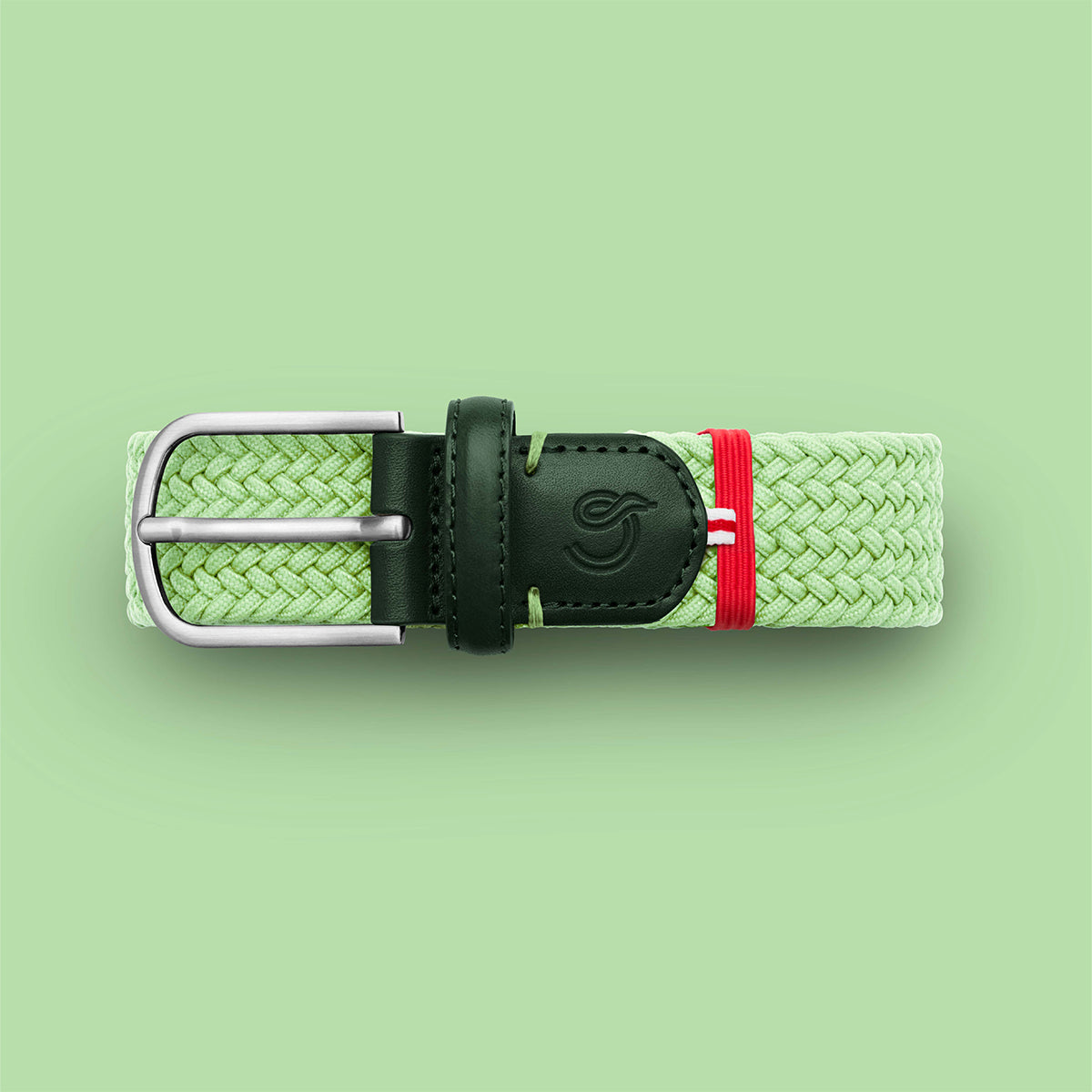La Boucle mono Mykonos woven belt folded on pale green background