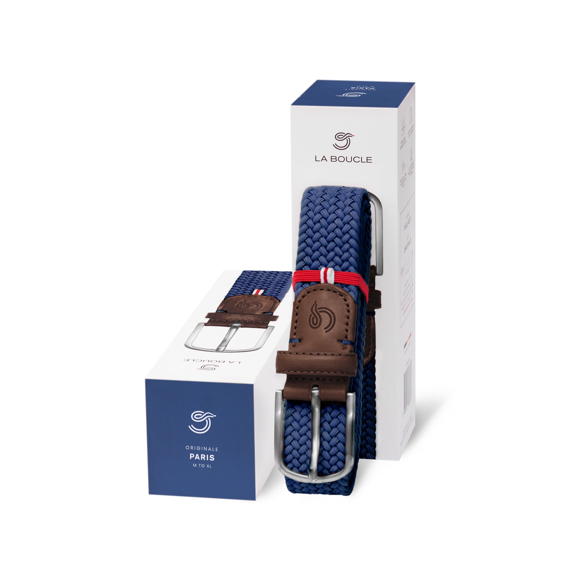 La Boucle mono Paris woven belt folded and leaning on a box next to a box on white background