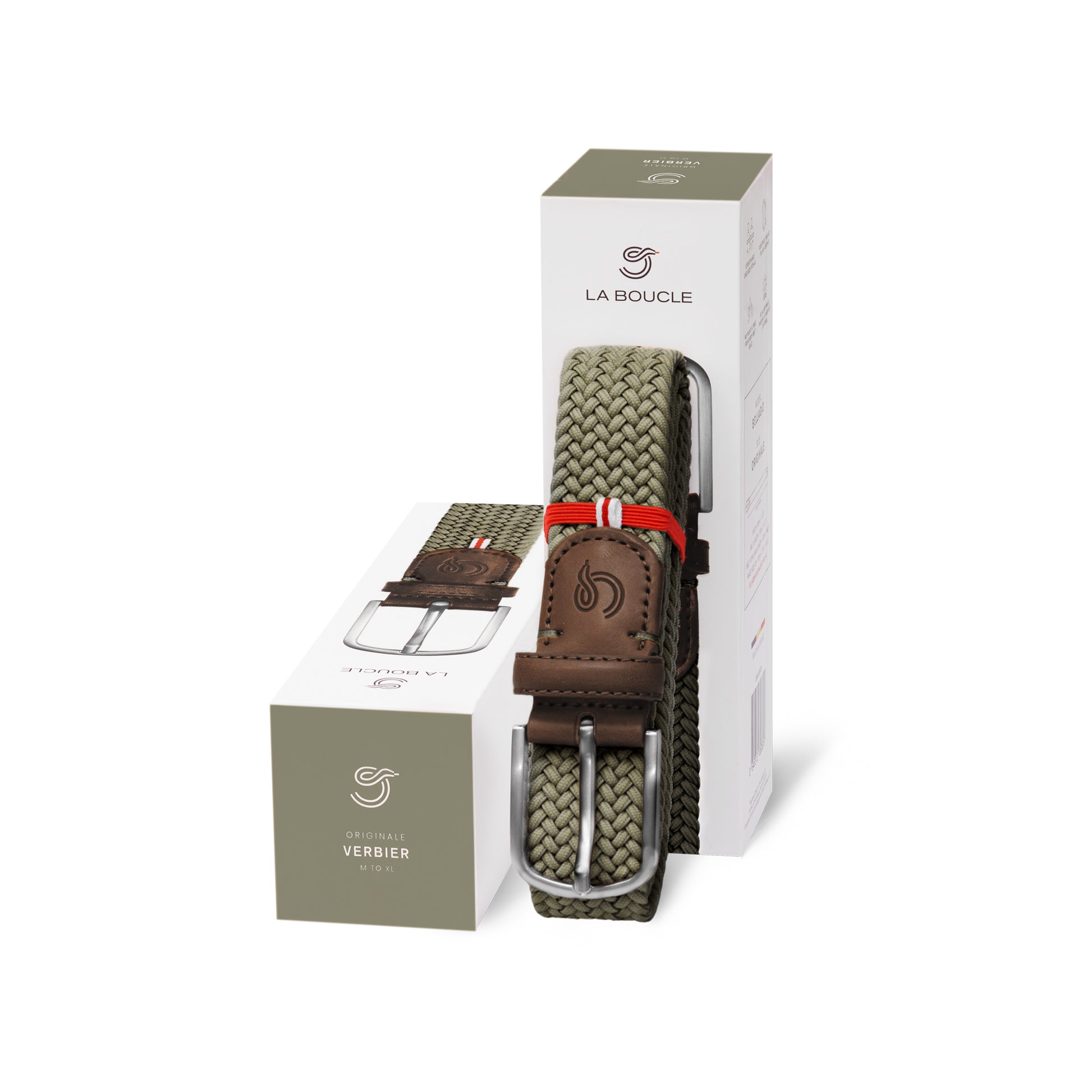 La Boucle mono Verbier woven belt folded and leaning on a box next to a box on white background