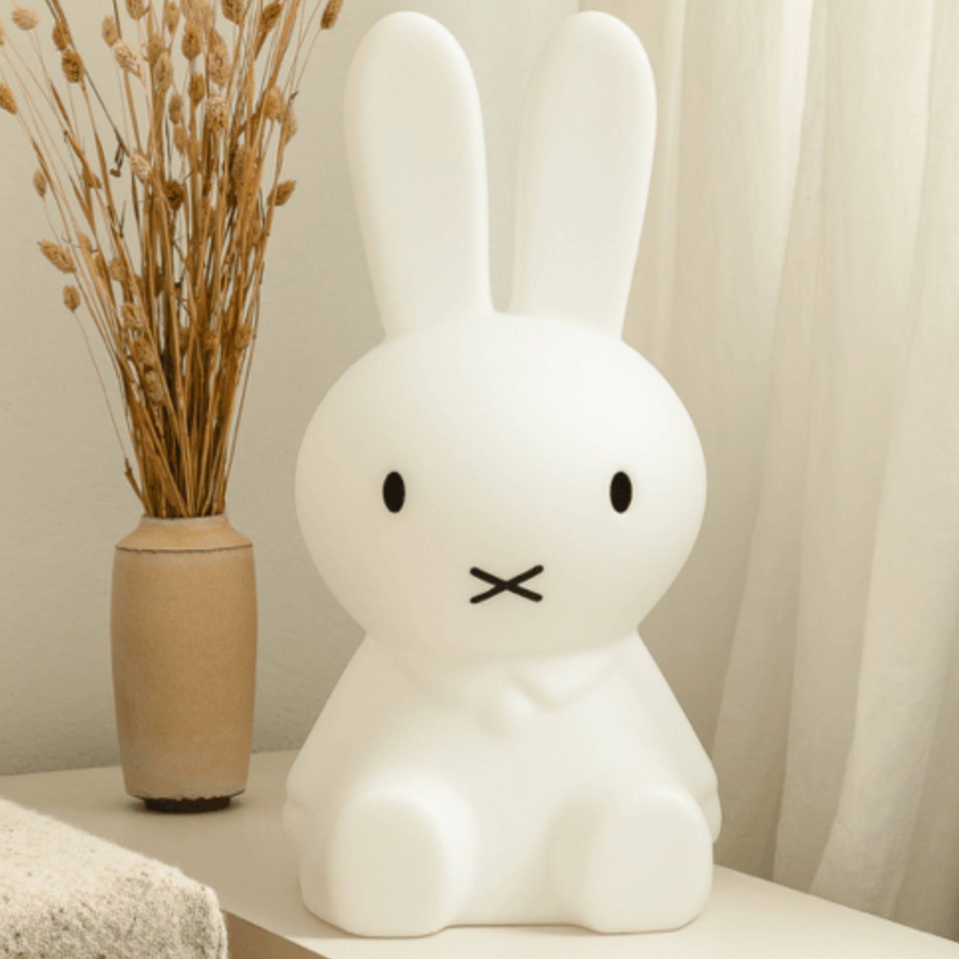 Lifestyle shot of childrends Mr Maria white Miffy 30cm night light on display turned off