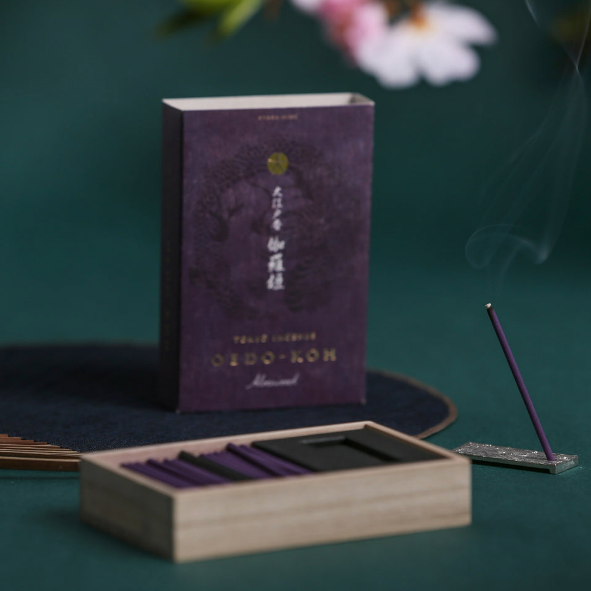 Oedo-Koh Incense Aloeswood on display burning on included incense stand infront of unboxed incense