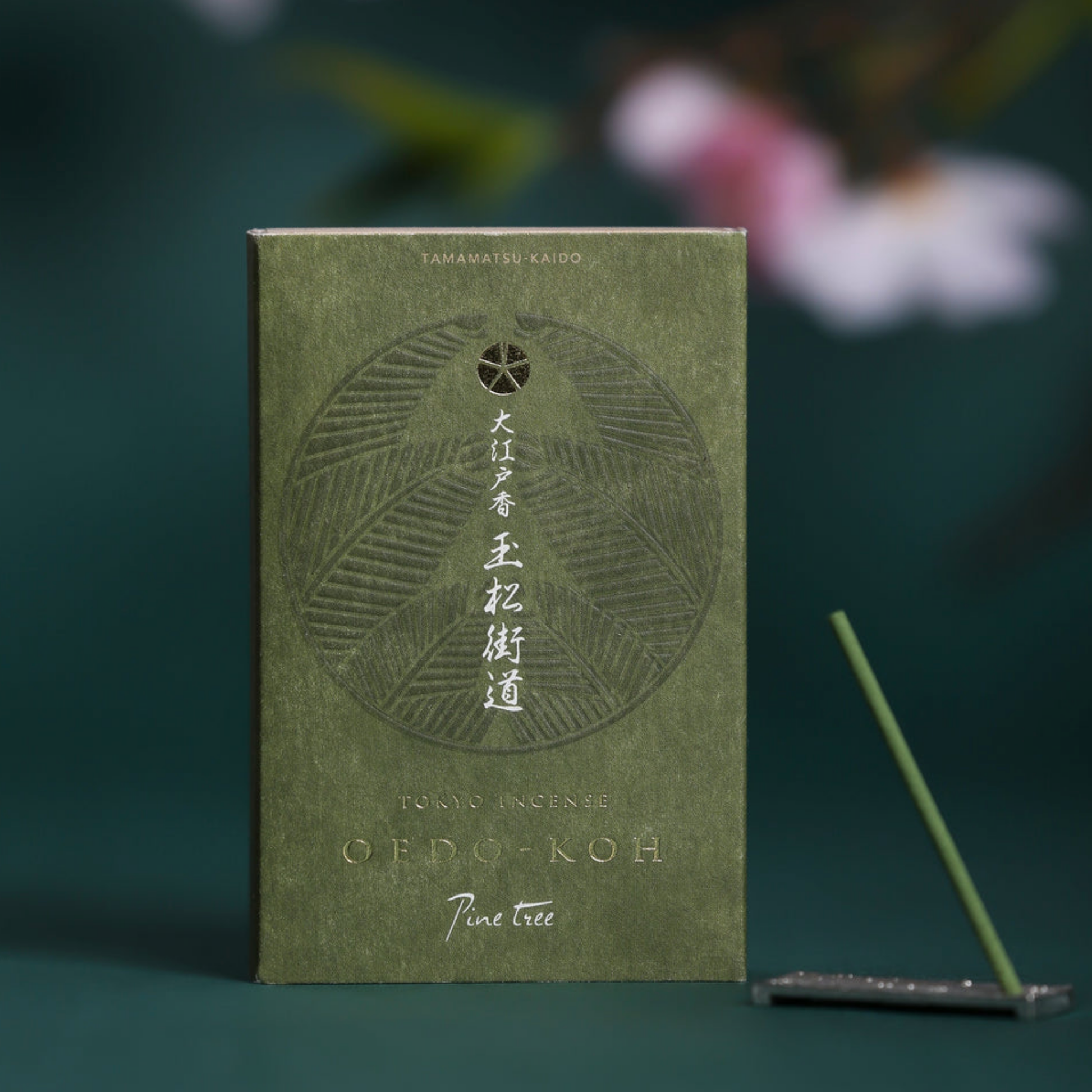 Oedo-Koh Incense Pine Tree on display with incence out of packaging stood in included incense stand next to box 