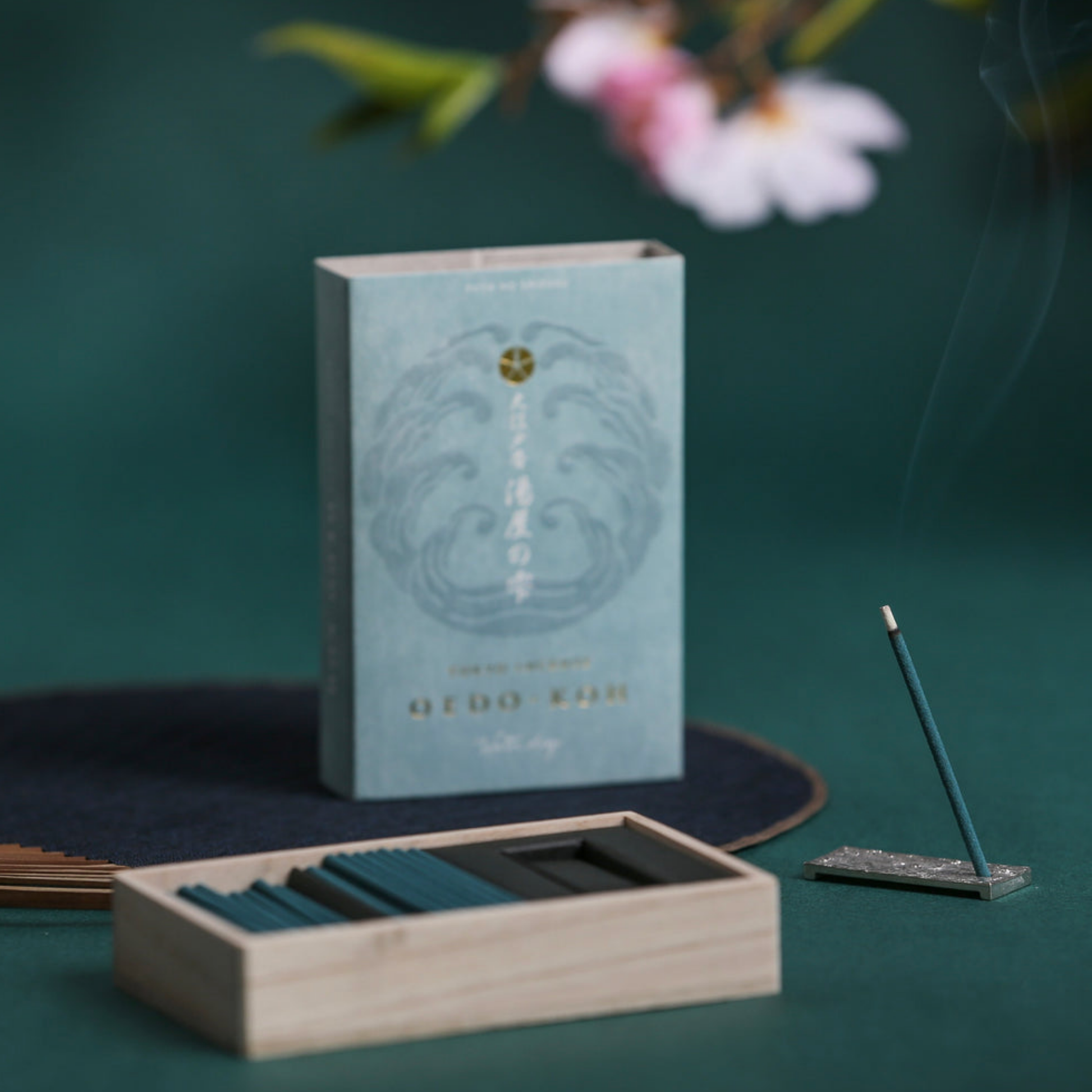 Oedo-Koh Incense Water Drop on display burning with incence out of packaging stood in included incense stand