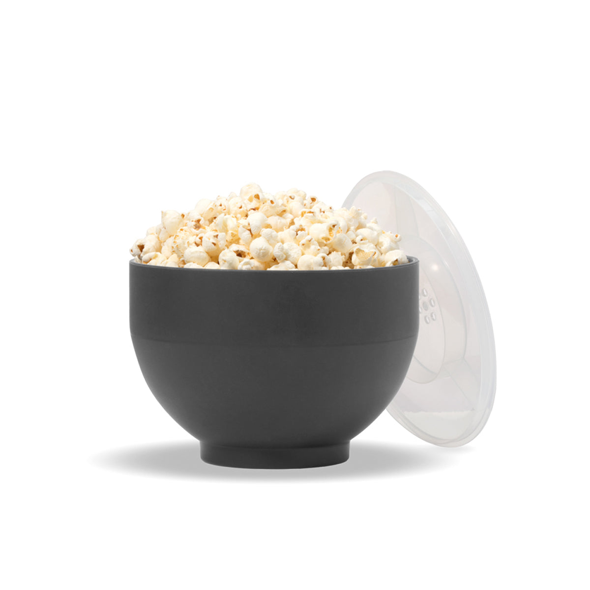 WP charcoal popcorn popper full with popcorn and lid leaning on white background