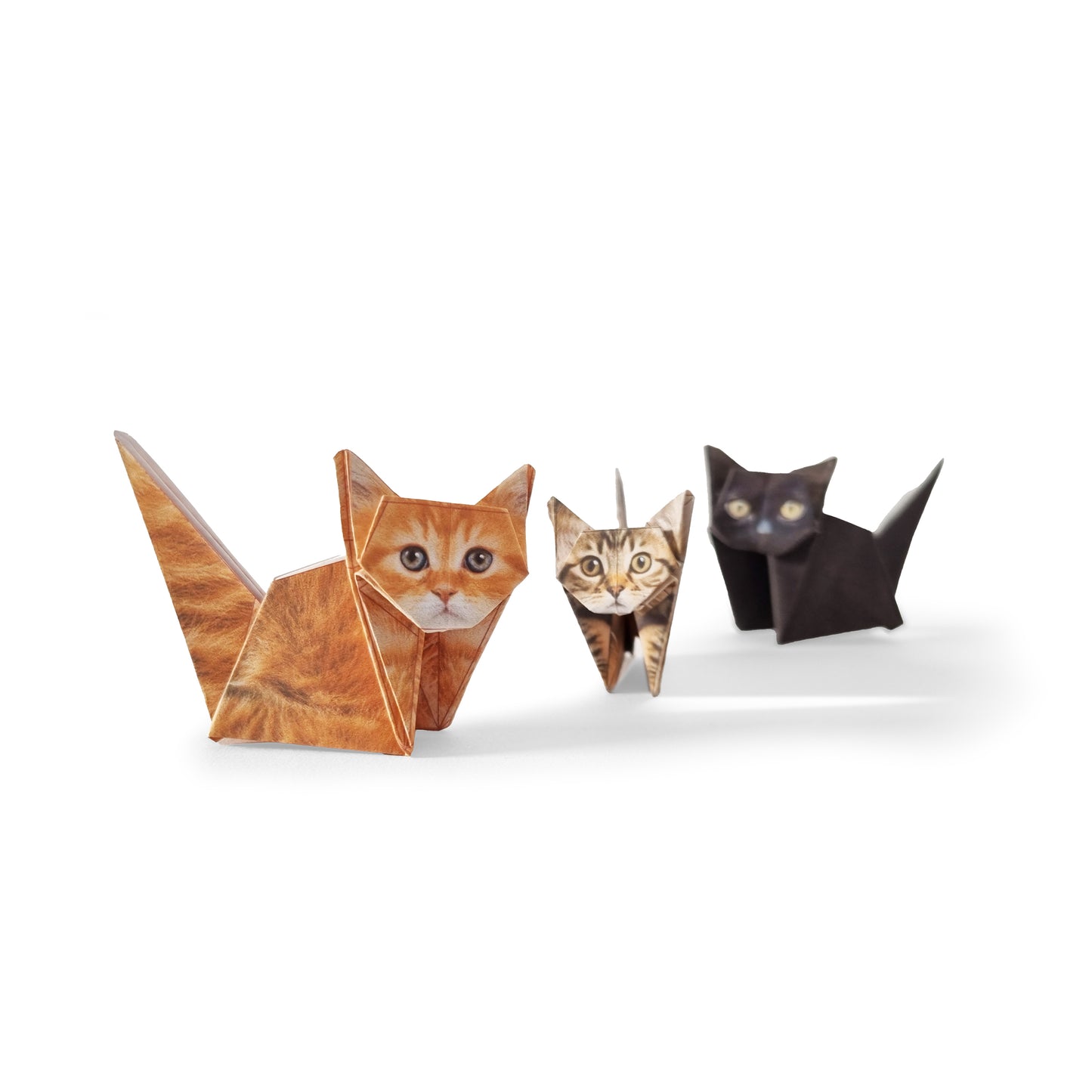 Orange, black-grey and black paper cats from Paper Cats origami kit - foldable multi-color FSC paper set featuring 50 cat and kitten designs, eco-friendly paper material with soy-based printing, includes step-by-step instructions for creating assorted life-like paper cats.