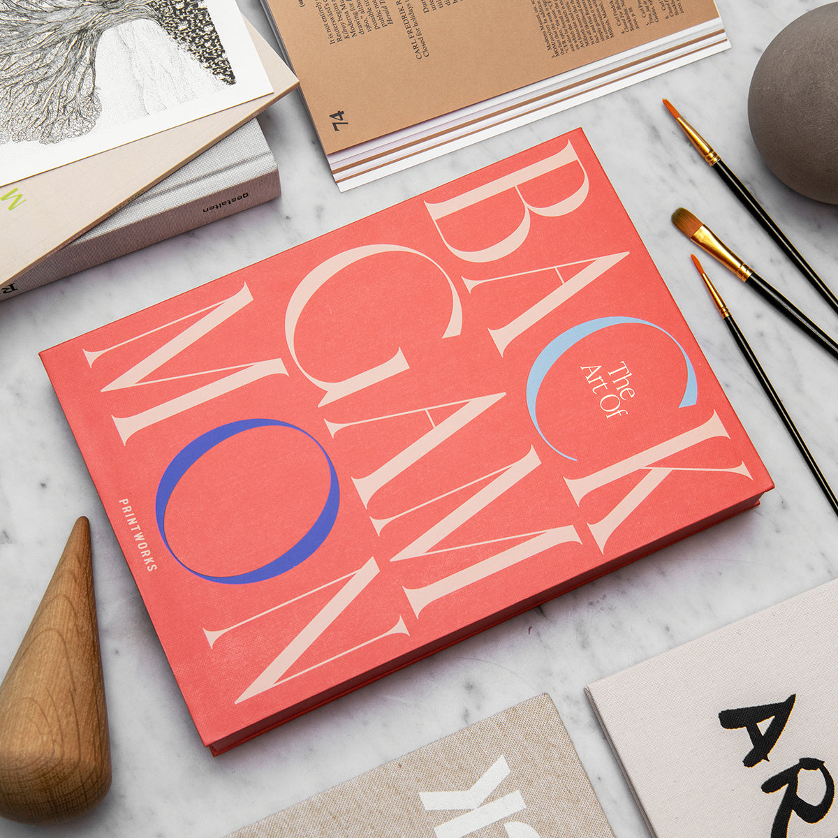 Printworks classic games art of backgammon bright orange box on an angle white marble table 