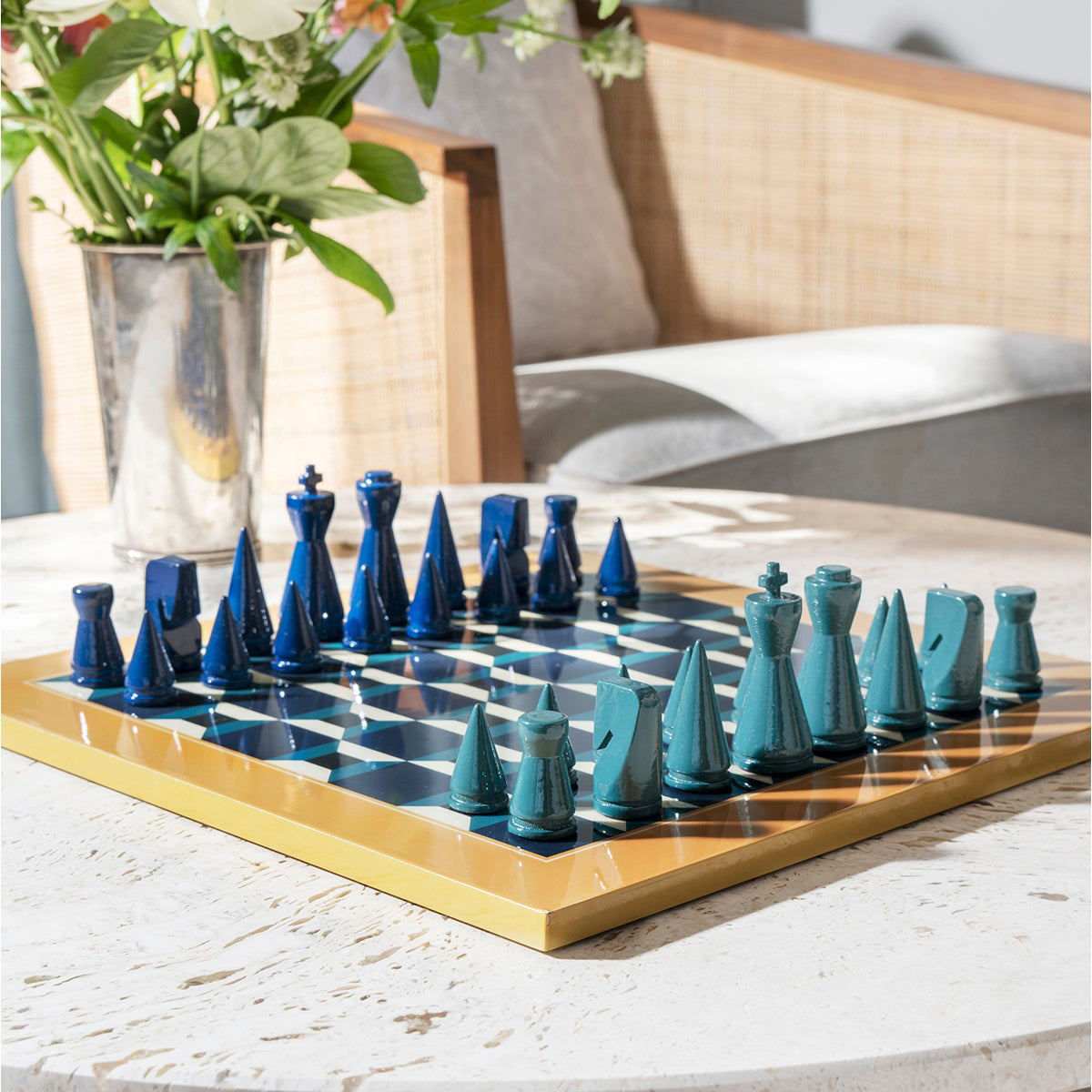 Printworks classic chess game lacquered athena set up with pieces on marble table with flowers