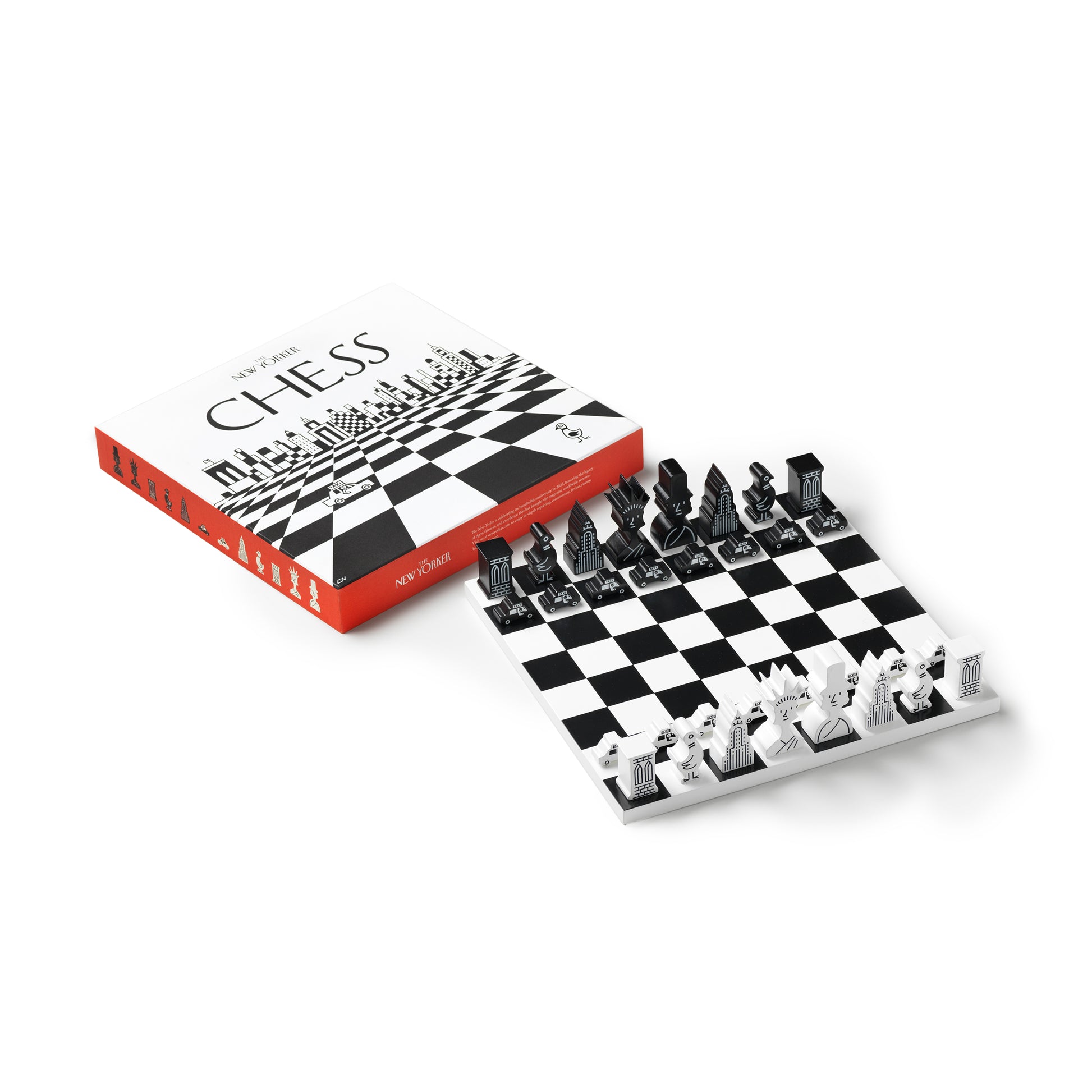 Printworks classic chess game The New Yorker Edition set up with wooden pieces next to the box lid lying down with a white background