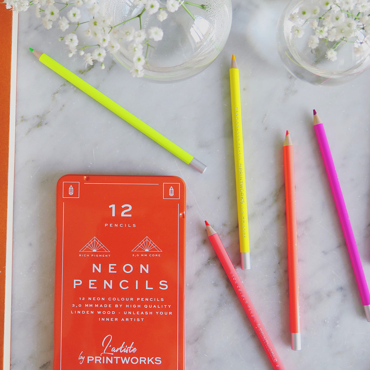 Printworks Neon pencils set of 12 on white marble table with 5 loose neon pencils